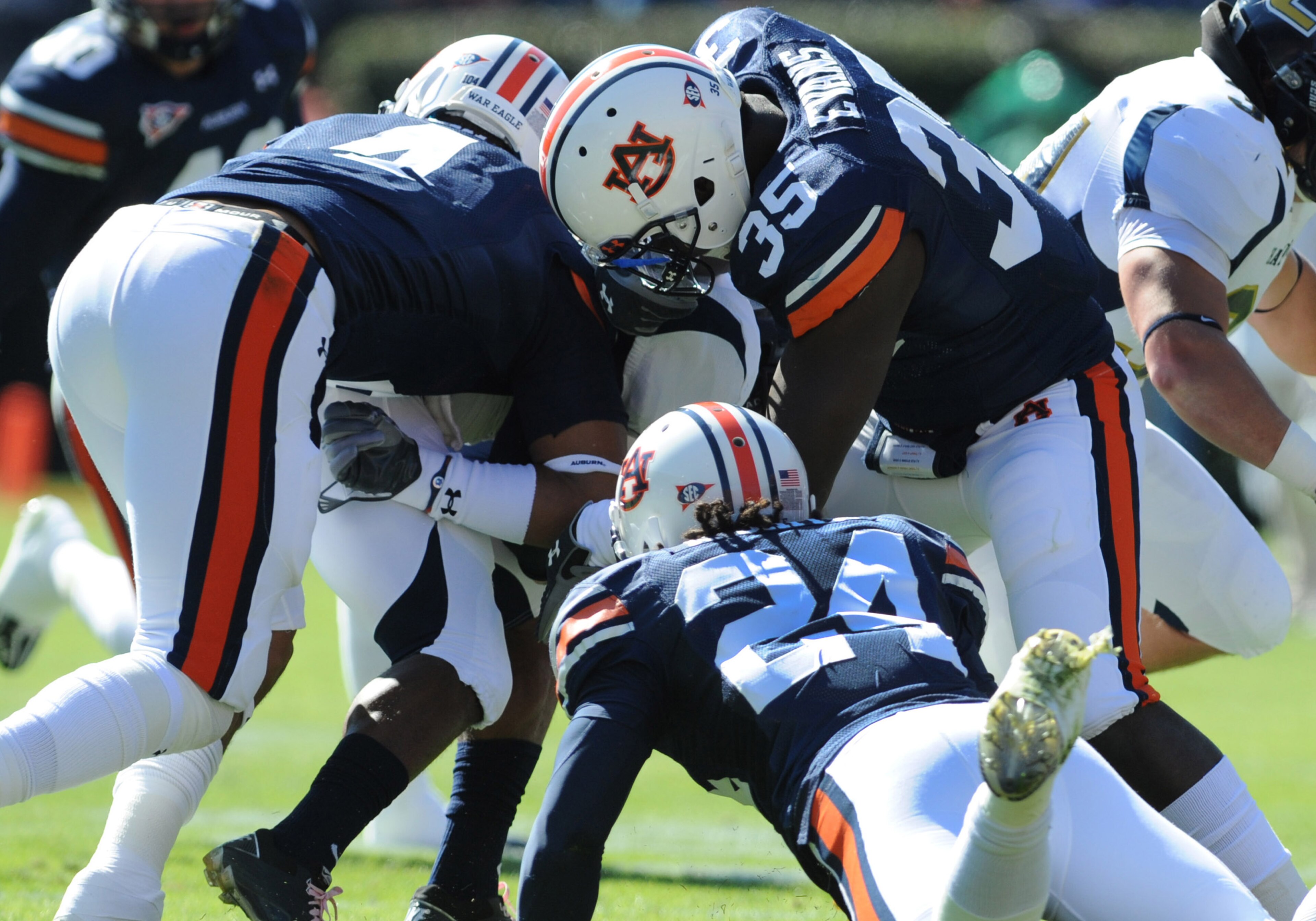 AUBURN, AL - NOVEMBER 6:  Special teams players of the Auburn Tigers tackle wide receiver Brian Sutherland #1 of the Chattanooga Mocs on a kickoff return November 6, 2010 at Jordan-Hare Stadium in Auburn, Alabama.  (Photo by Al Messerschmidt/Getty Images)