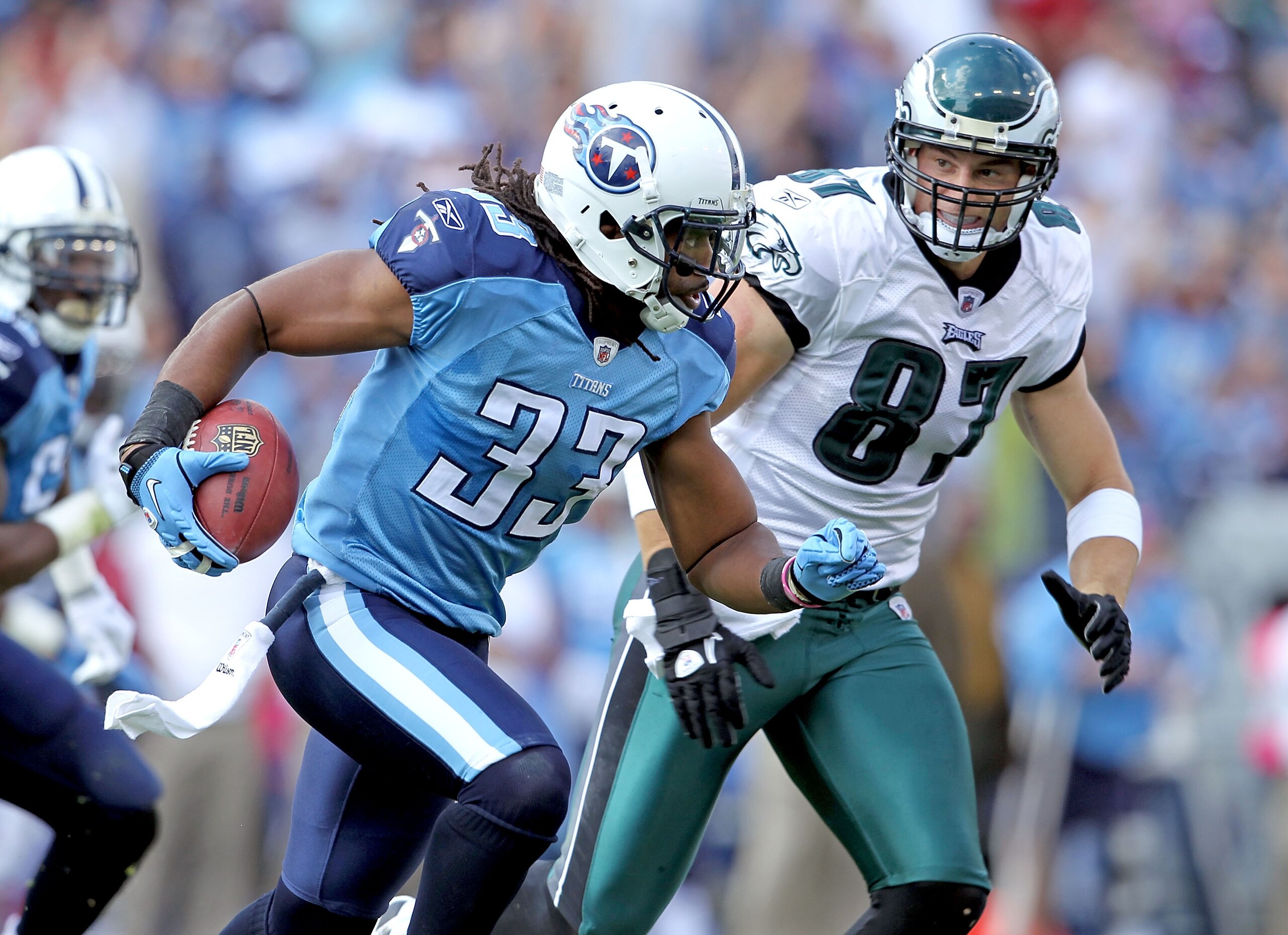 NASHVILLE, TN - OCTOBER 24: Michael Griffin #33 of the Tennessee Titans runs with the ball after intercepting a pass while defended by Brent Celek #87 of the Philadelphia Eagles at LP Field on October 24, 2010 in Nashville, Tennessee. The Titans won 37-19