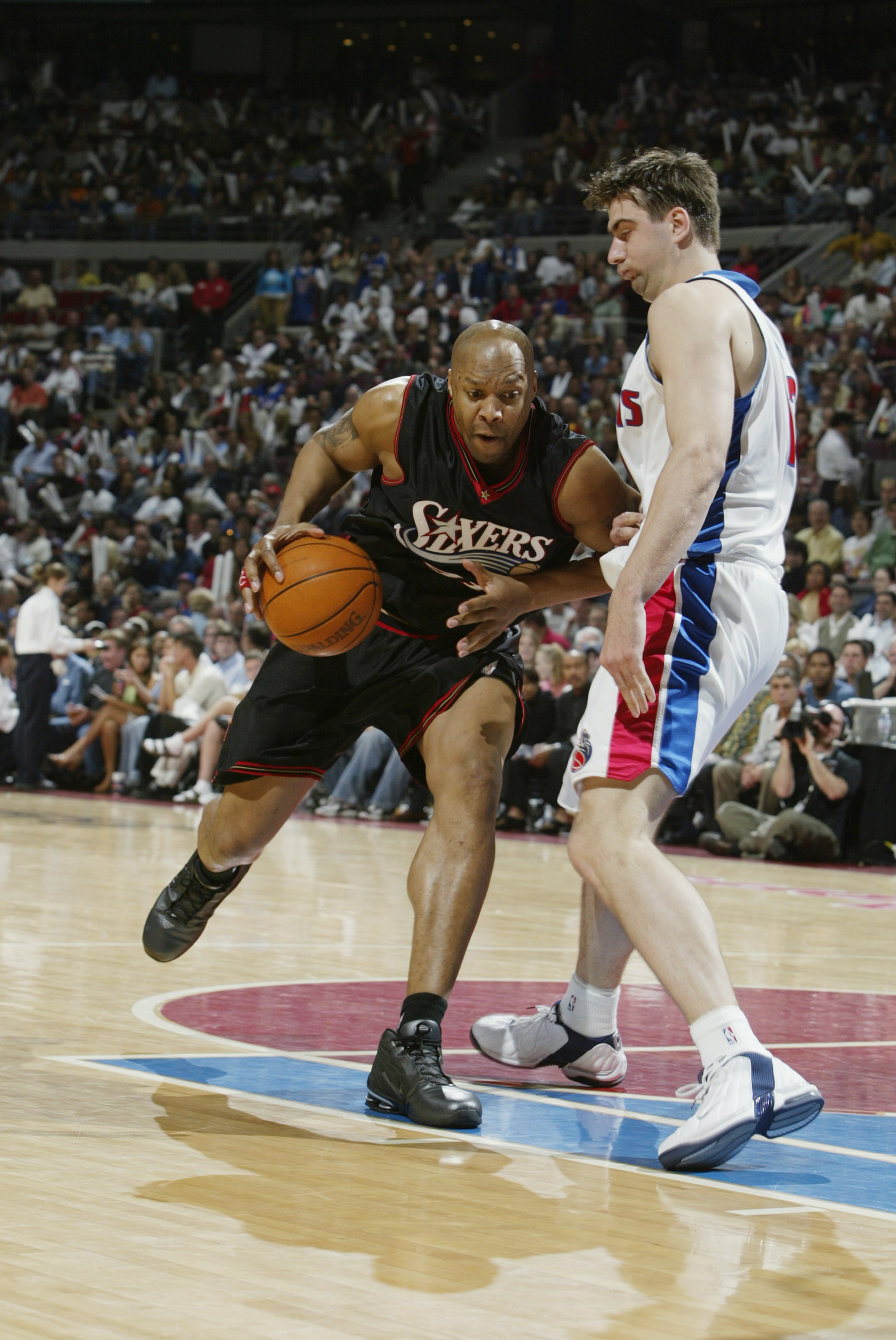 AUBURN HILLS, MI - MAY 6:  Derrick Coleman #44 of the Philadelphia 76ers drives against Mehmet Okur #13 of the Detroit Pistons in Game one of the Eastern Conference Semifinals during the 2003 NBA Playoffs at The Palace of Auburn Hills on May 6, 2003 in Au