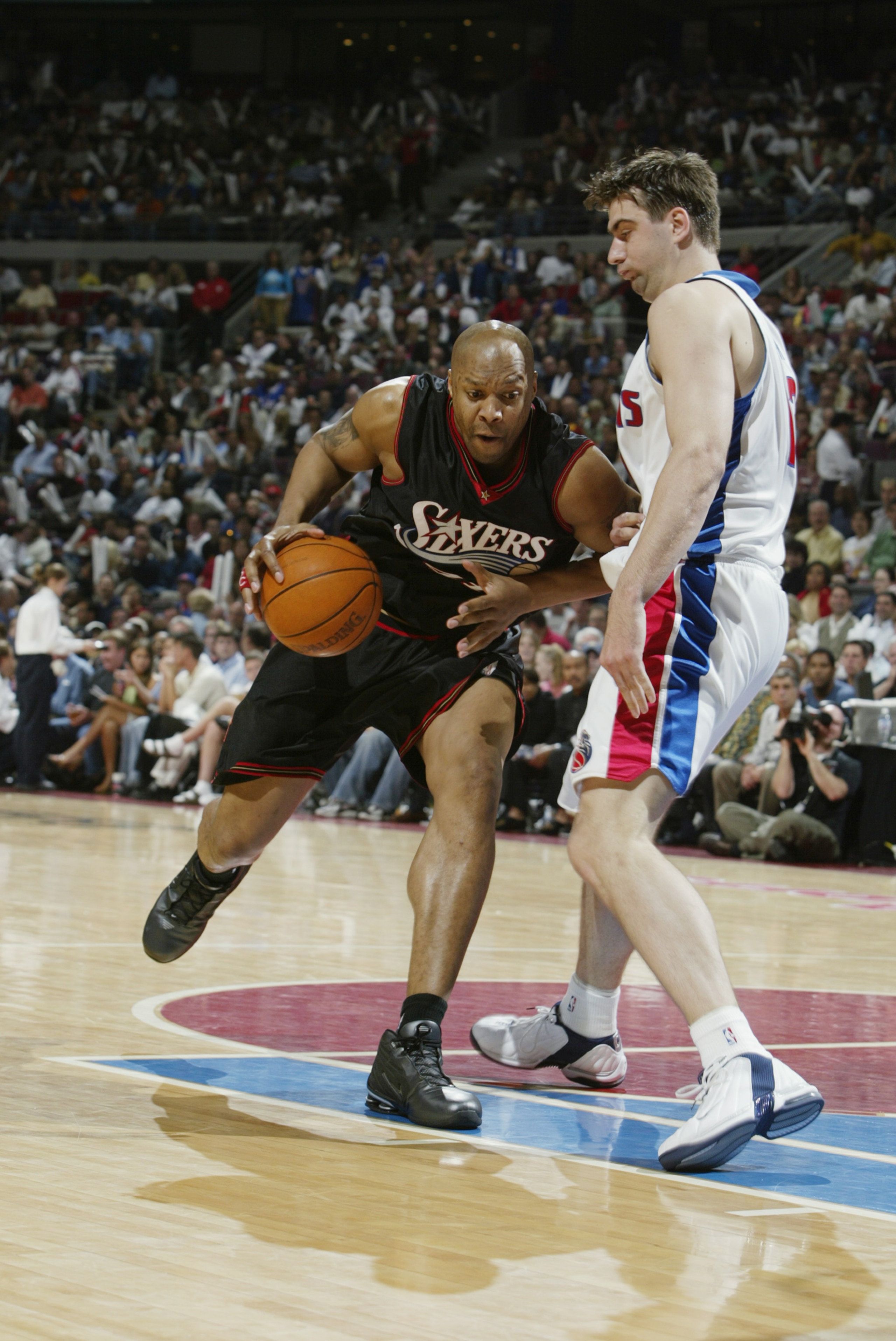 AUBURN HILLS, MI - MAY 6:  Derrick Coleman #44 of the Philadelphia 76ers drives against Mehmet Okur #13 of the Detroit Pistons in Game one of the Eastern Conference Semifinals during the 2003 NBA Playoffs at The Palace of Auburn Hills on May 6, 2003 in Au