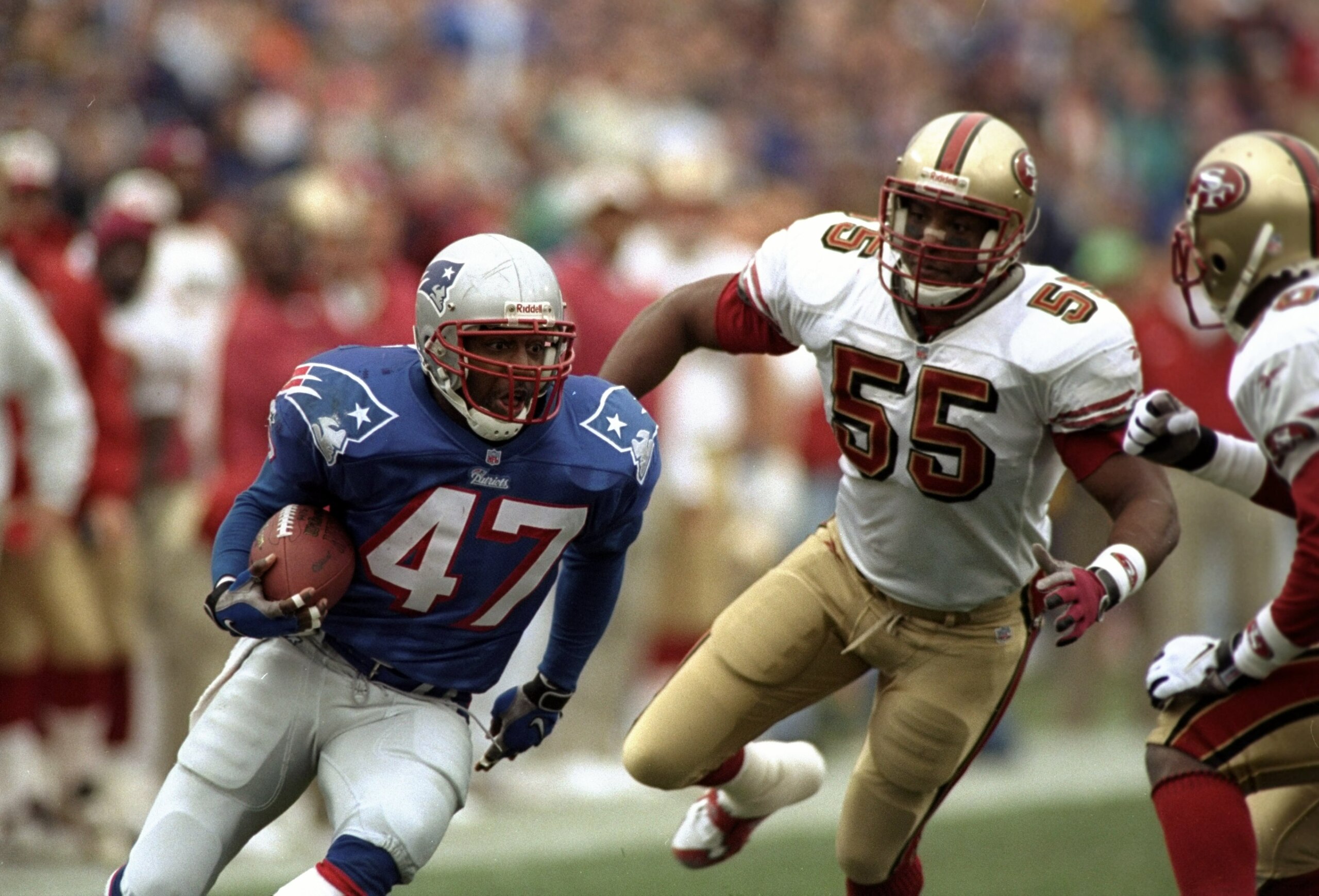 20 Dec 1998:  Running back Robert Edwards #47 of the New England Patriots in action against linebacker Winford Tubbs #55 of the San Francisco 49ers during the game at Foxboro Stadium in Foxboro, Massachusetts. The Patriots defeated the 49''ers 24-21. Mand