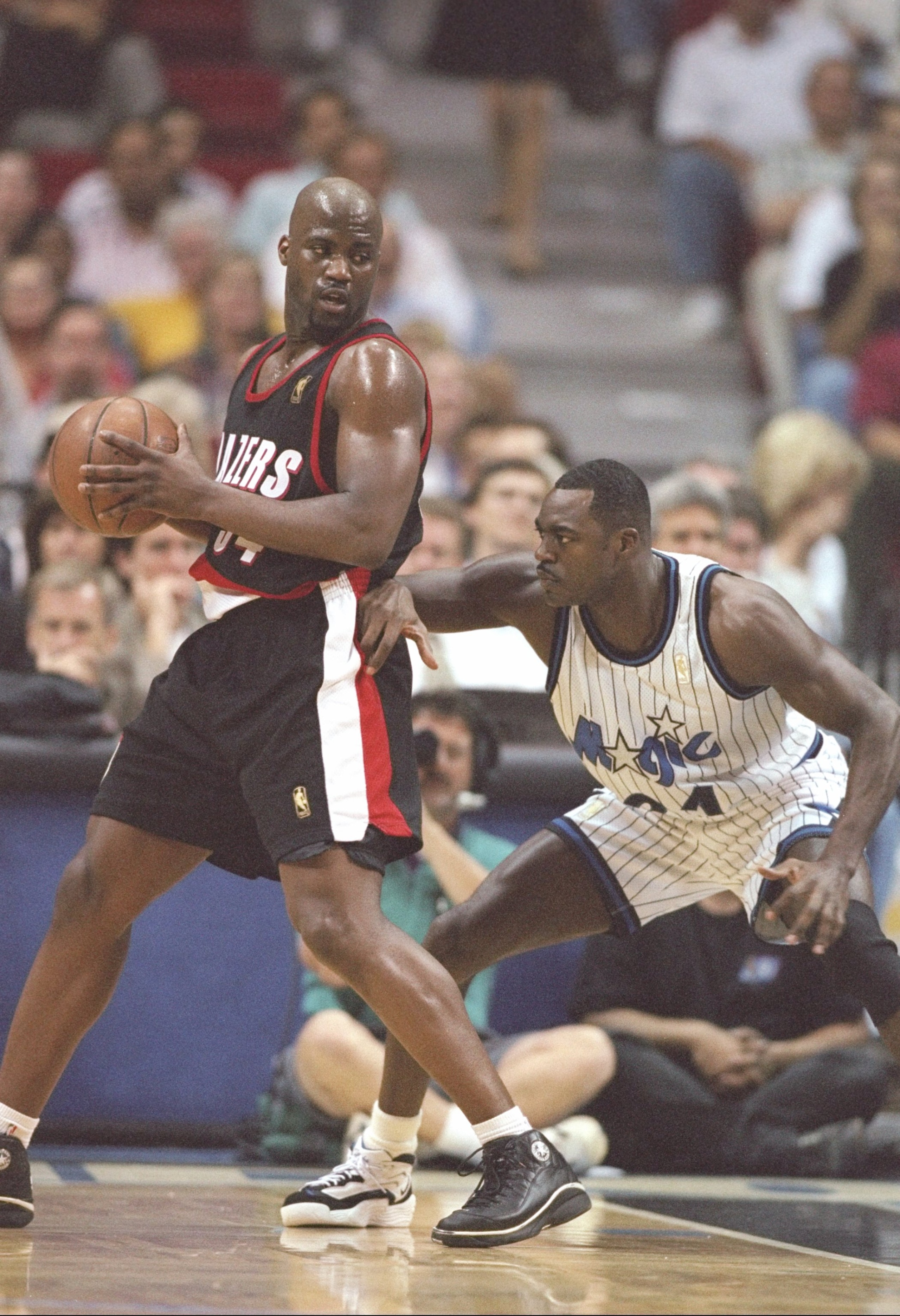 13 Feb 1997:  Guard Isiah Rider of the Portland Trailblazers tries to pass the ball as guard Gerald Wilkins of the Orlando Magic guards him at the Orlando Arena in Orlando, Florida.  The Magic won the game 95-84. Mandatory Credit: Andy Lyons  /Allsport