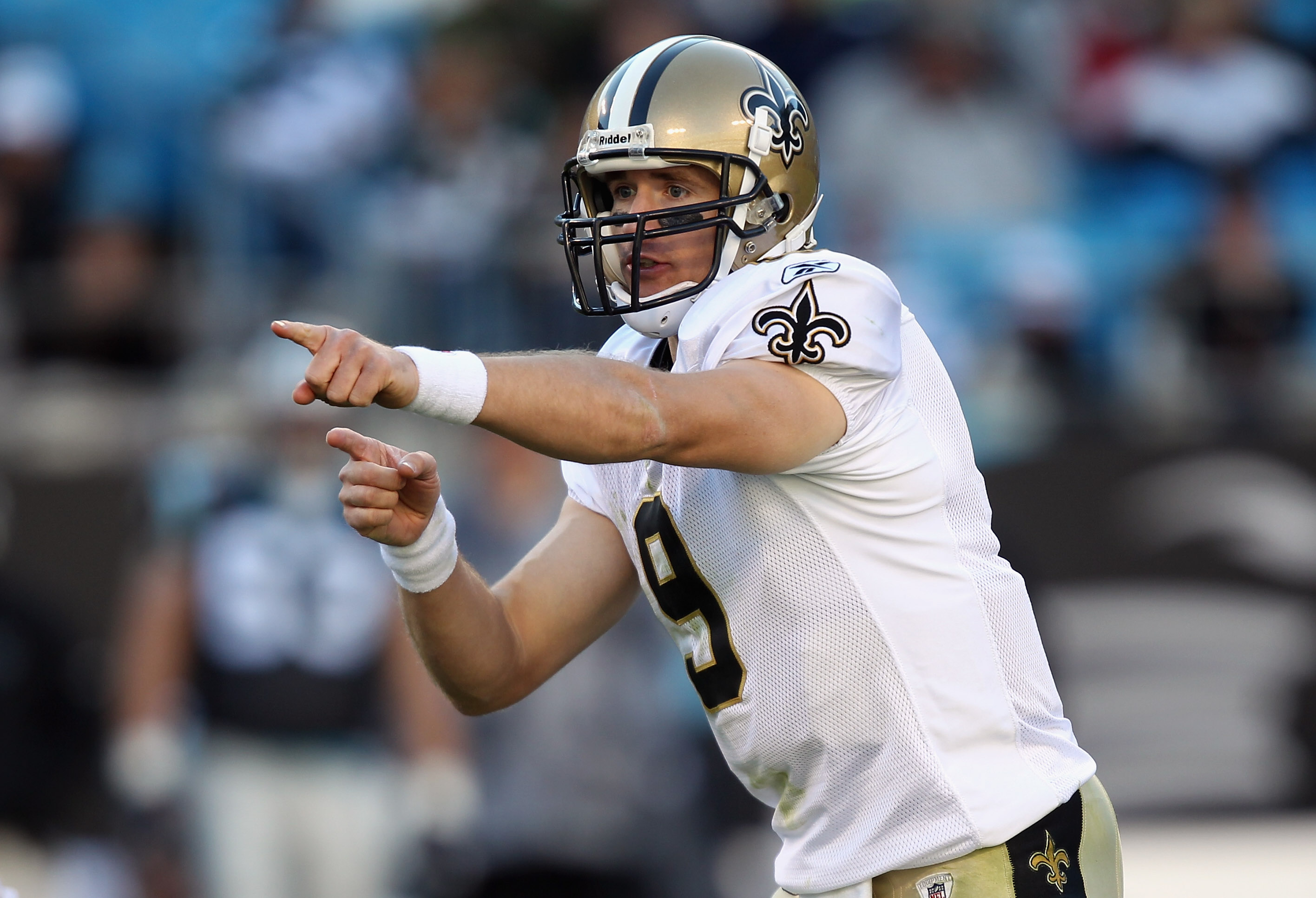 CHARLOTTE, NC - NOVEMBER 07:  Drew Brees #9 of the New Orleans Saints calls a play against the Carolina Panthers during their game at Bank of America Stadium on November 7, 2010 in Charlotte, North Carolina.  (Photo by Streeter Lecka/Getty Images)