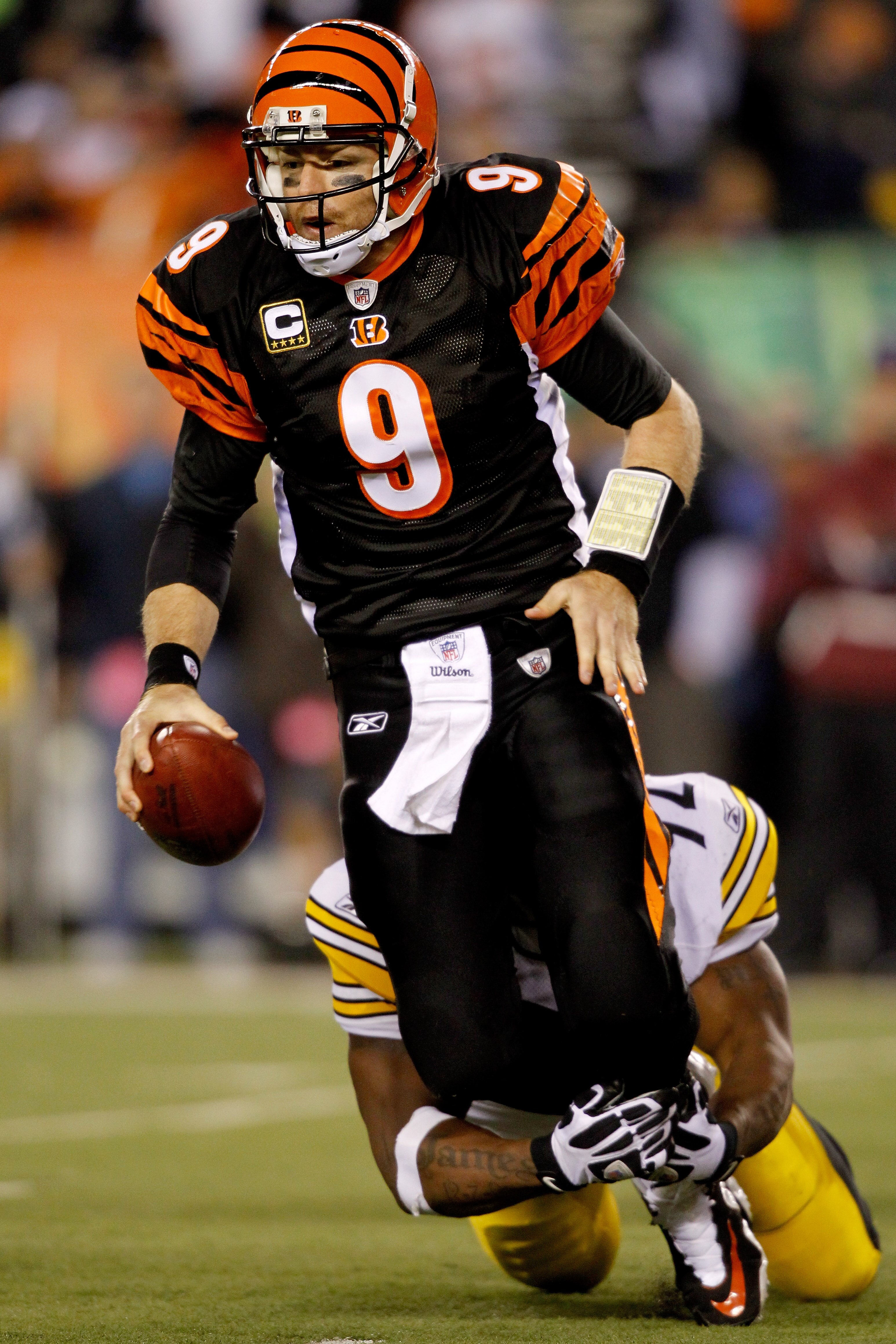 CINCINNATI - NOVEMBER 08:  Carson Palmer #9 of the Cincinnati Bengals is brought down from behind by James Harrison #92 of the Pittsburgh Steelers at Paul Brown Stadium on November 8, 2010 in Cincinnati, Ohio.  (Photo by Matthew Stockman/Getty Images)