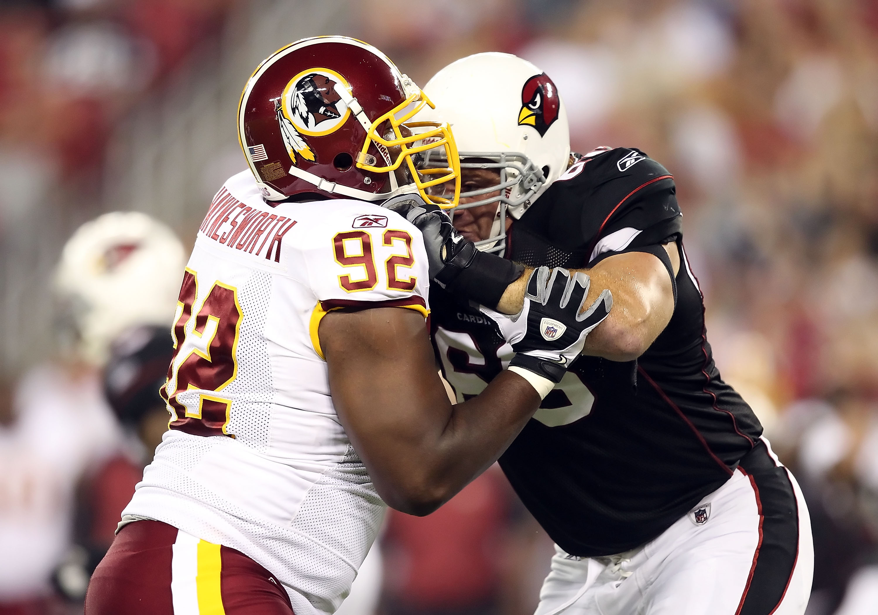 GLENDALE, AZ - SEPTEMBER 02:  Defensive tackle Albert Haynesworth #92 of the Washington Redskins battles for position with Alan Faneca #66 of the Arizona Cardinals during preseason NFL game at the University of Phoenix Stadium on September 2, 2010 in Glen