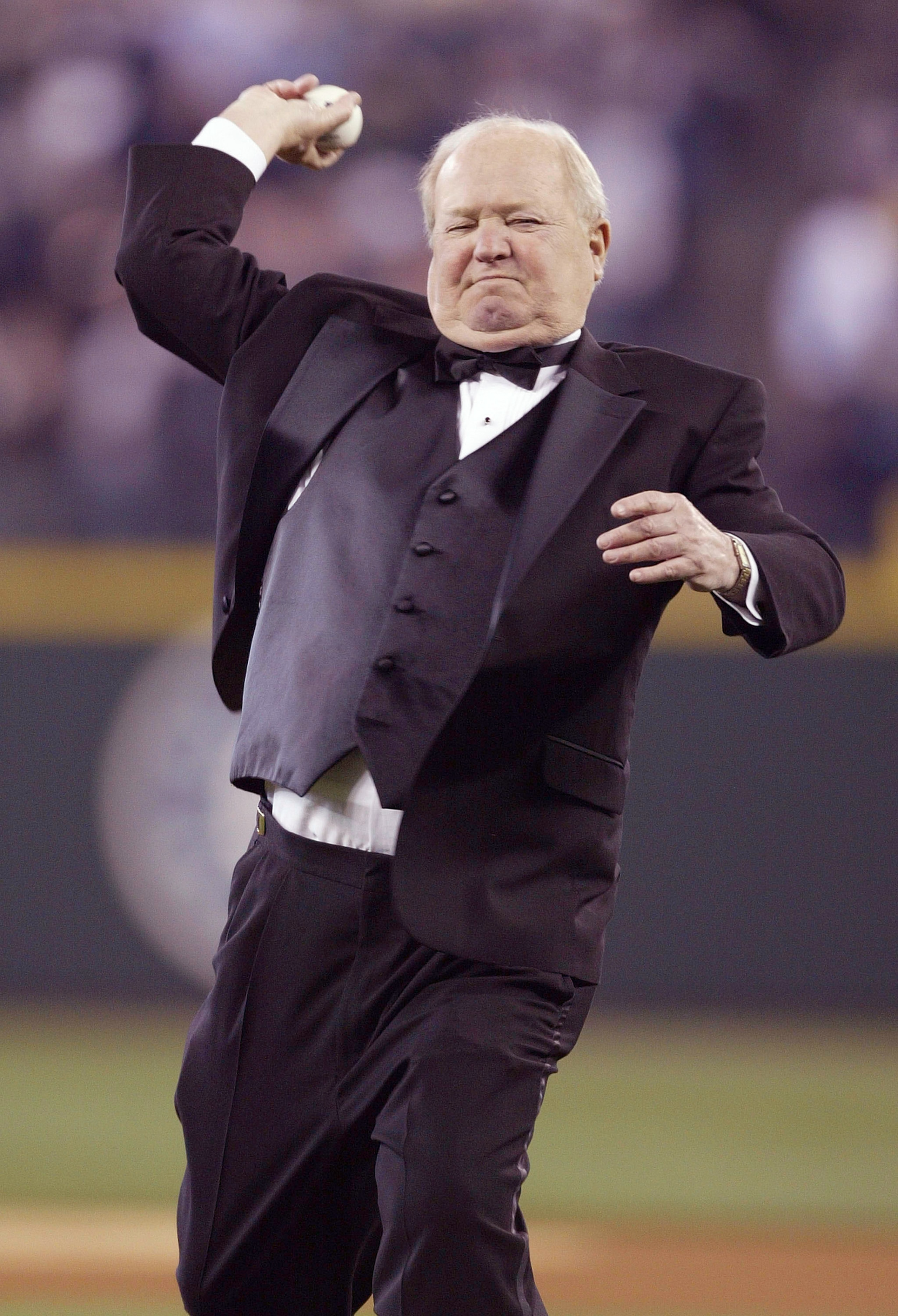 SEATTLE - MARCH 31:  Seattle Mariners play-by-play announcer Dave Niehaus throws out the ceremonial first pitch prior to the Mariners' Home Opener against the Texas Rangers on March 31, 2008 in Seattle, Washington. The Mariners defeated the Rangers 5-2. (