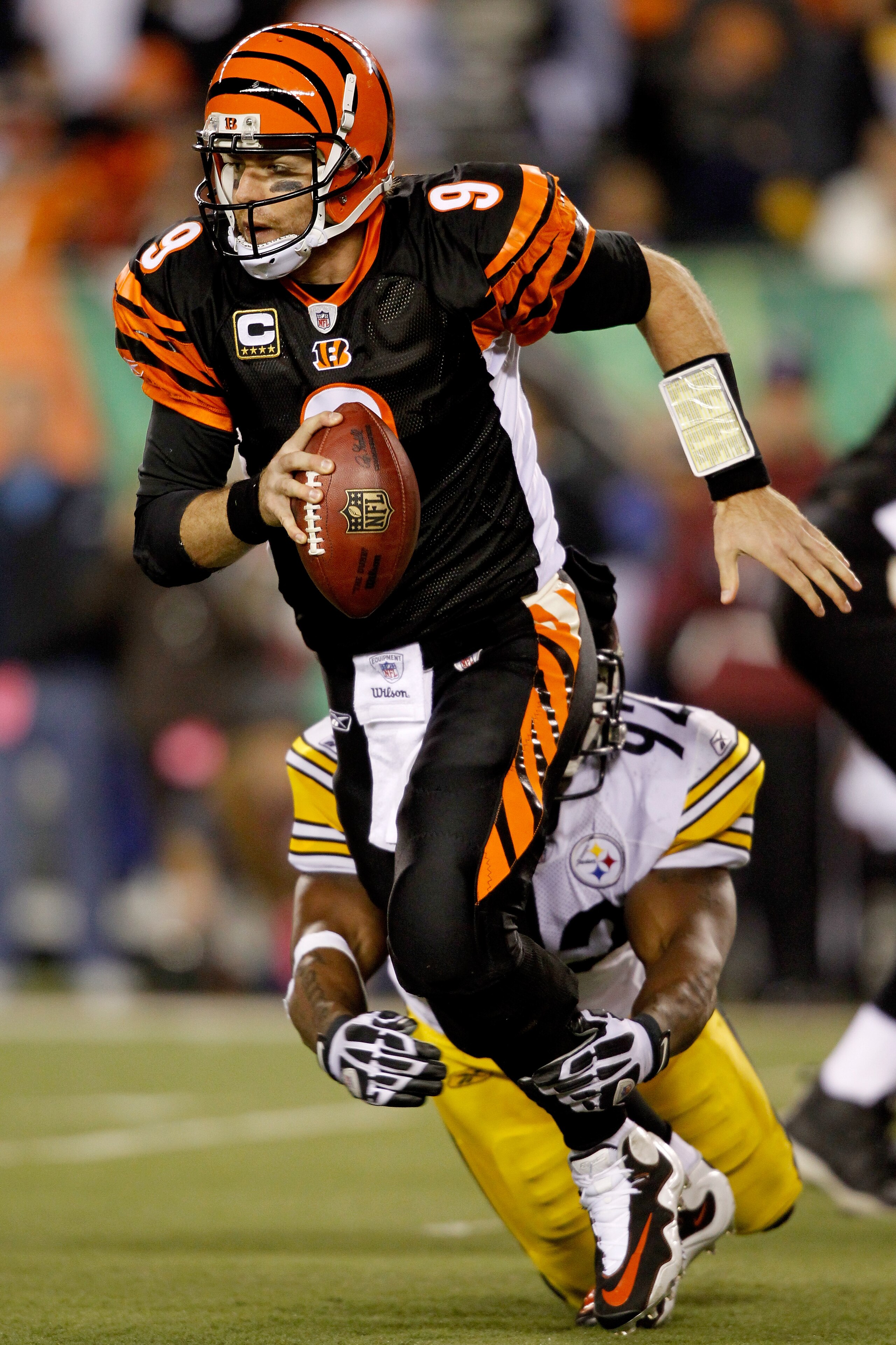 CINCINNATI - NOVEMBER 08:  Carson Palmer #9 of the Cincinnati Bengals is brought down from behind by James Harrison #92 of the Pittsburgh Steelers at Paul Brown Stadium on November 8, 2010 in Cincinnati, Ohio.  (Photo by Matthew Stockman/Getty Images)