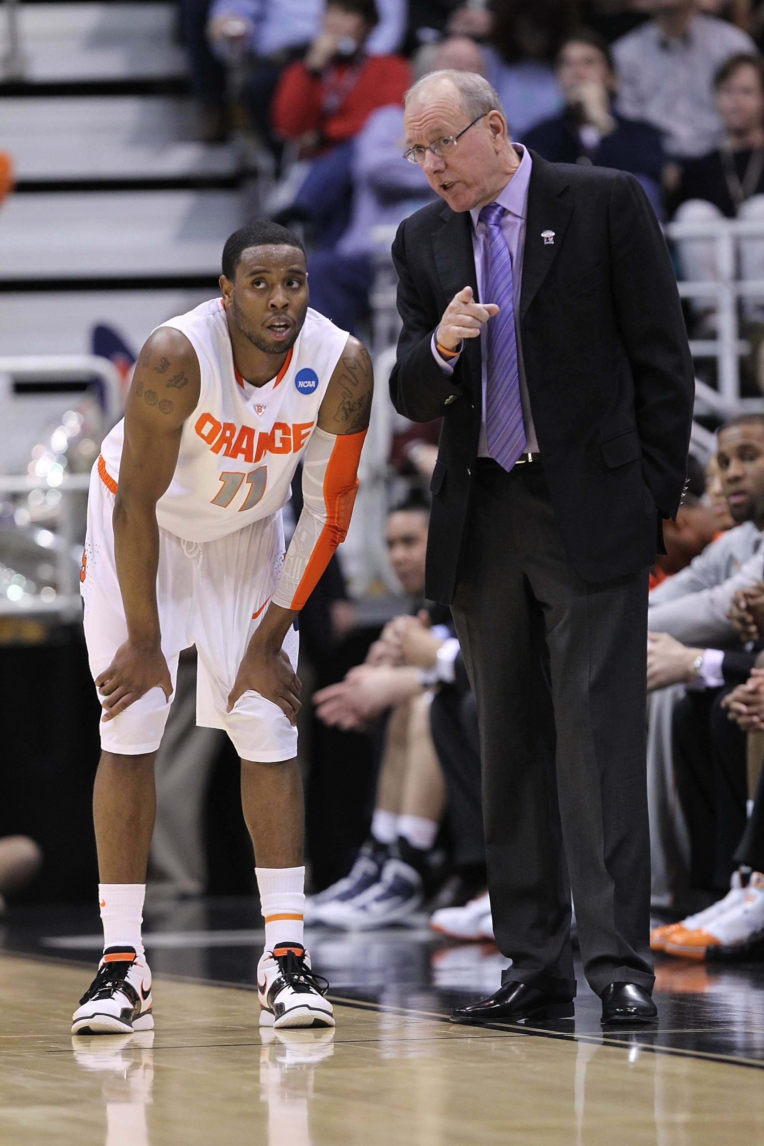 SALT LAKE CITY - MARCH 25:  Head coach Jim Boeheim of the Syracuse Orange talks with Scoop Jardine #11 against the Butler Bulldogs during the west regional semifinal of the 2010 NCAA men's basketball tournament at the Energy Solutions Arena on March 25, 2