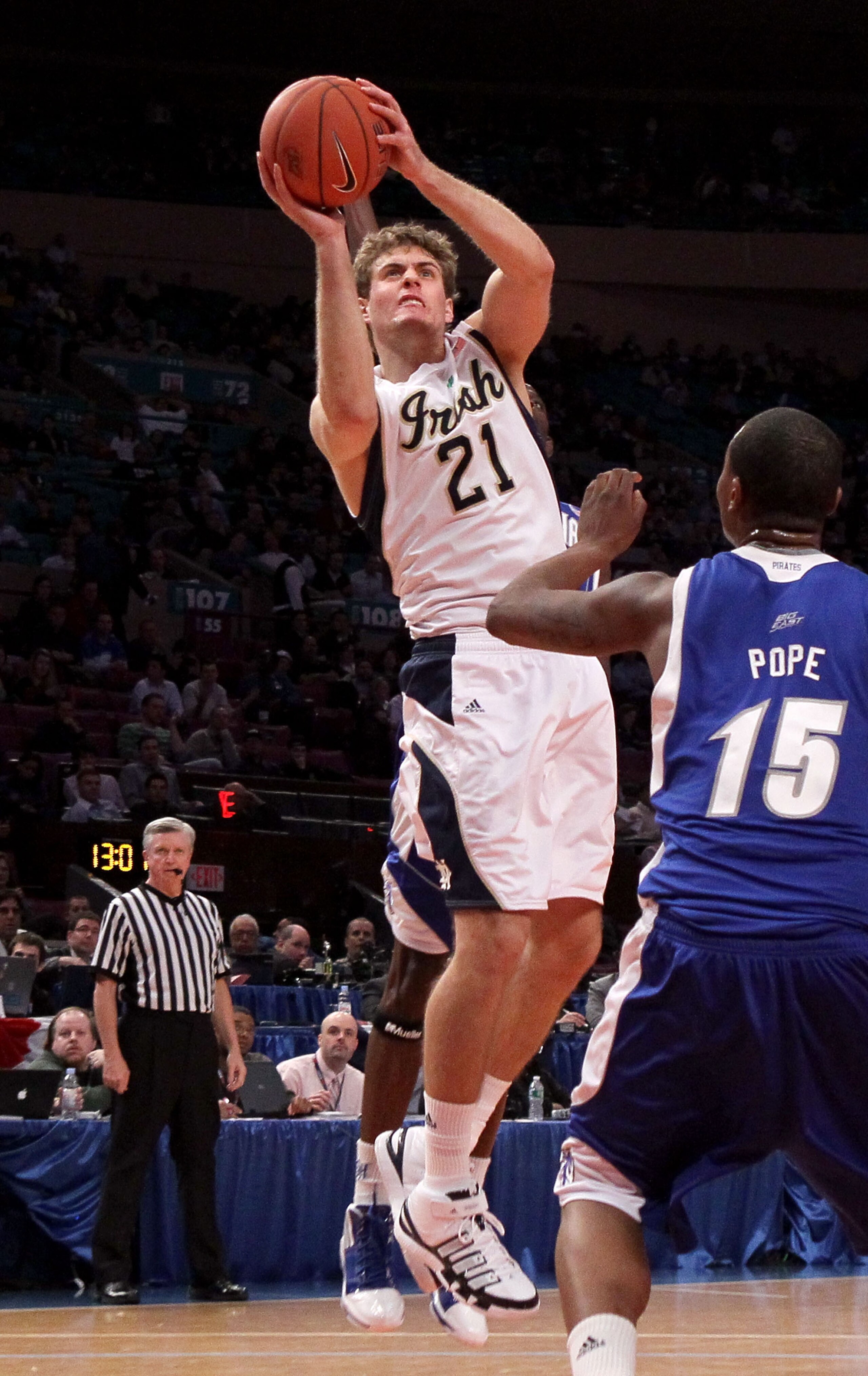 NEW YORK - MARCH 10: Tim Abromaitis #21 of the Notre Dame Fighting Irish shoots over Herb Pope #15 of the Seton Hall Pirates during the second round of 2010 NCAA Big East Tournament at Madison Square Garden on March 10, 2010 in New York City.  (Photo by J