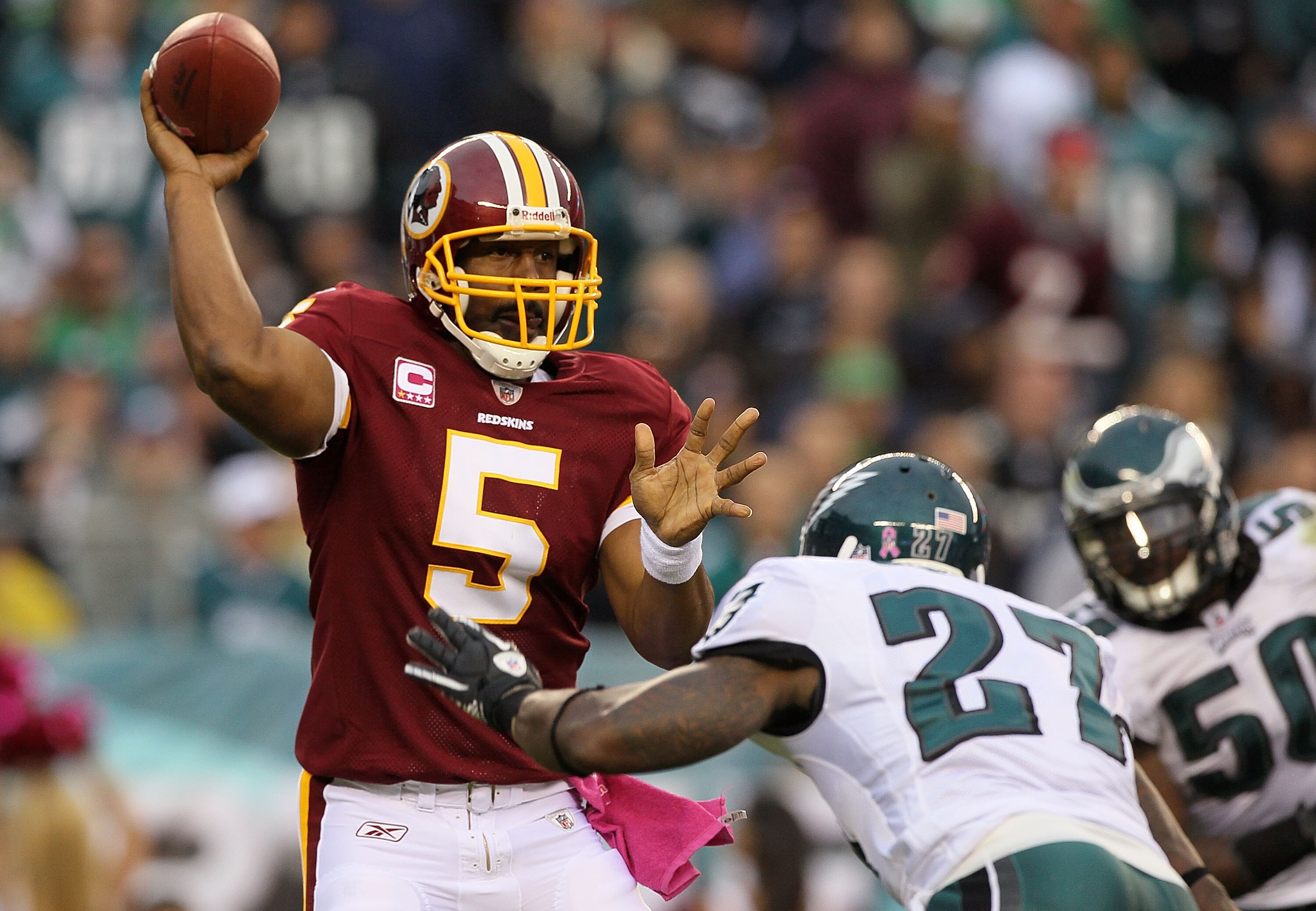 PHILADELPHIA - OCTOBER 03:  Donovan McNabb #5 of the Washington Redskins throws a pass under pressure from Quintin Mikell #27 of the Philadelphia Eagles on October 3, 2010 at Lincoln Financial Field in Philadelphia, Pennsylvania.  (Photo by Jim McIsaac/Ge