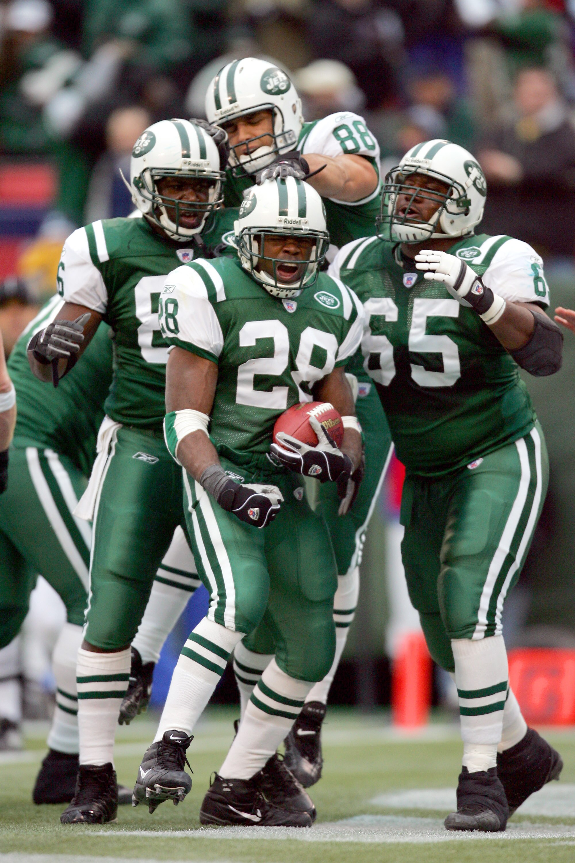 EAST RUTHERFORD, NJ - DECEMBER 19:  Curtis Martin #28 of the New York Jets celebrates with his teammates after his first touchdown in the second quarter against the Seattle Seahawks at Giants Stadium on December 19, 2004 in East Rutherford, New Jersey. (P