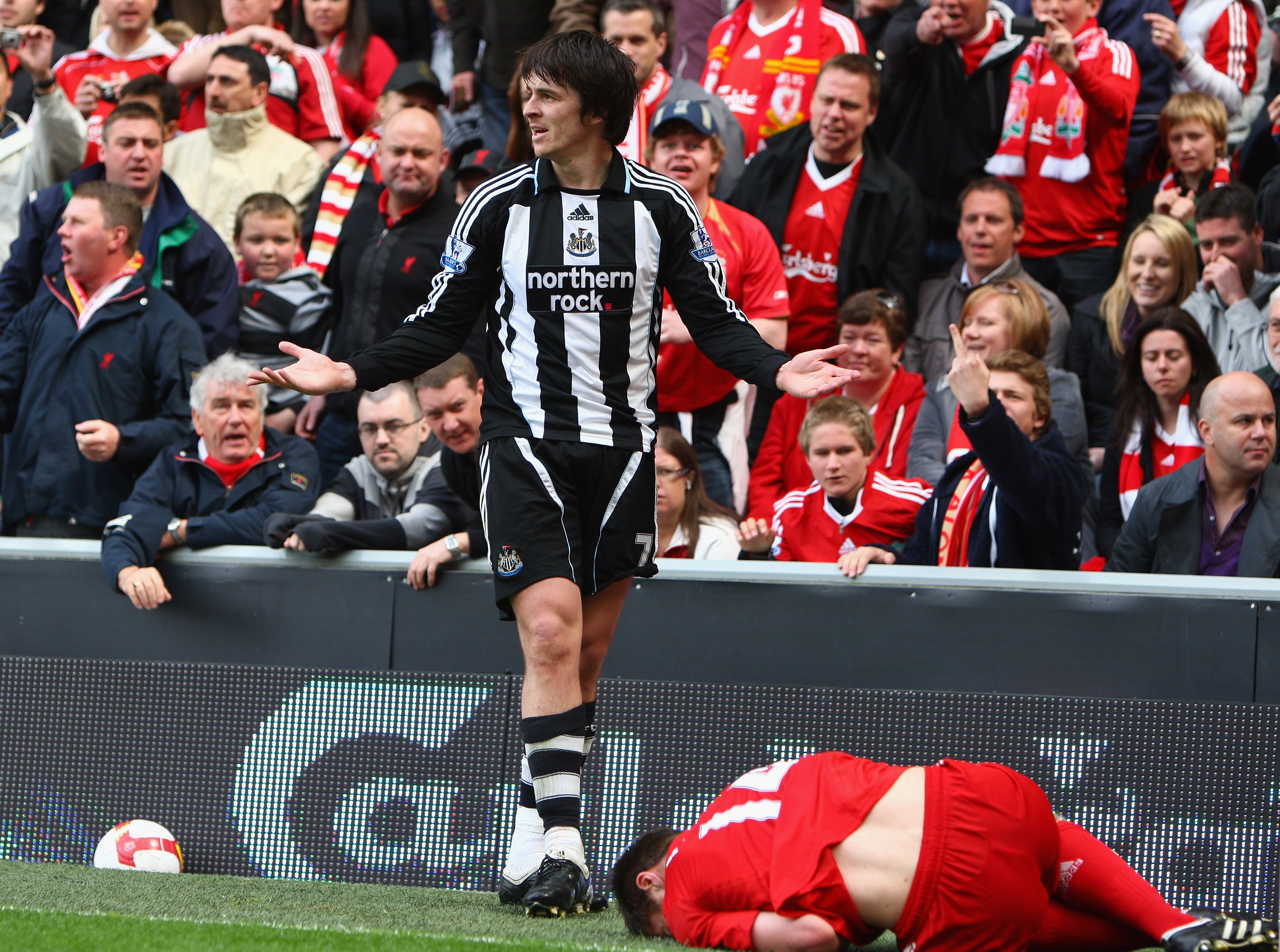 LIVERPOOL, UNITED KINGDOM - MAY 03:  Joey Barton of Newcastle United protests after a challenge on Xabi Alonso of Liverpool and is subsequently sent off by Referee Phil Dowd during the Barclays Premier League match between Liverpool and Newcastle United a