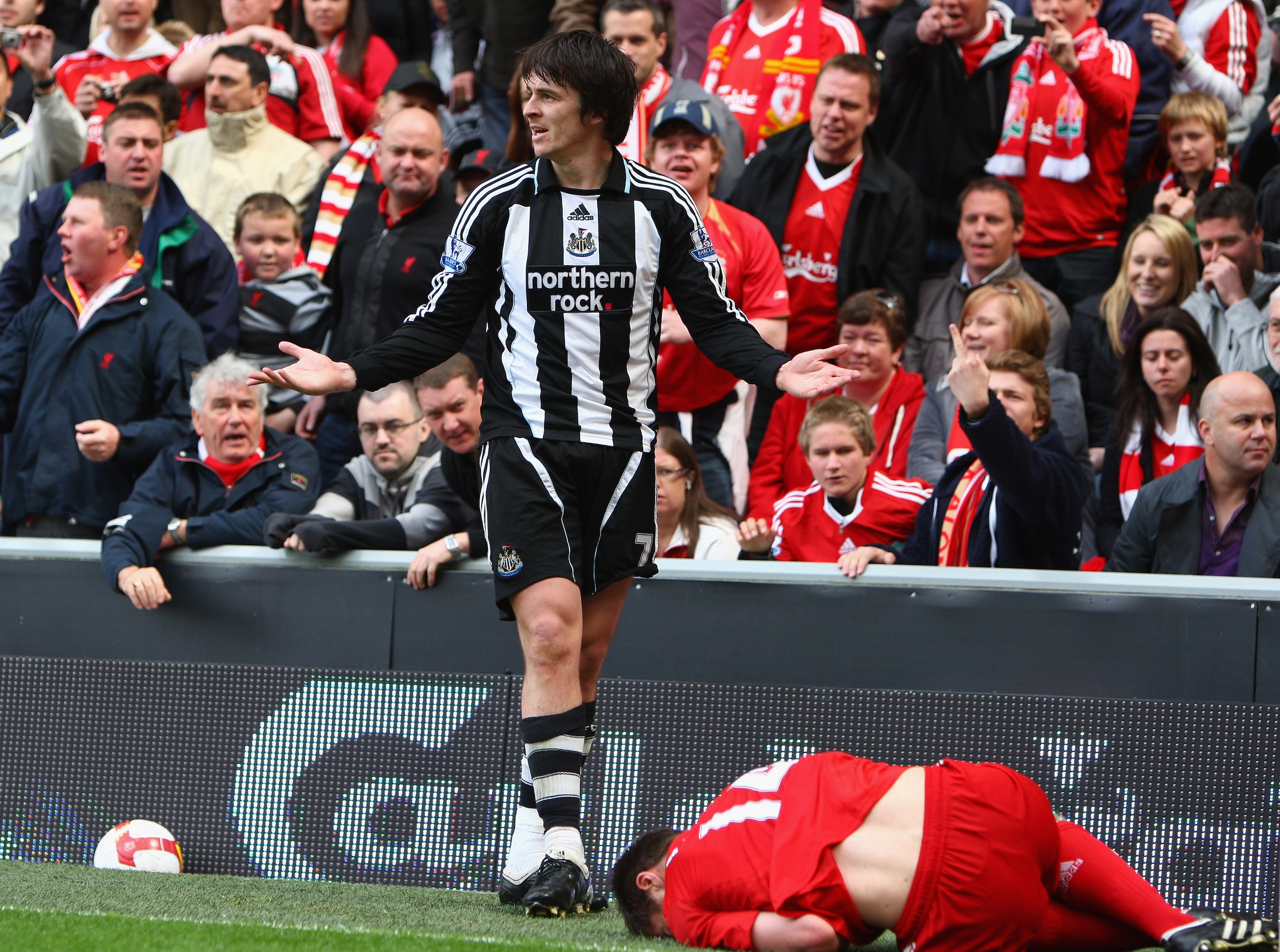 LIVERPOOL, UNITED KINGDOM - MAY 03:  Joey Barton of Newcastle United protests after a challenge on Xabi Alonso of Liverpool and is subsequently sent off by Referee Phil Dowd during the Barclays Premier League match between Liverpool and Newcastle United a