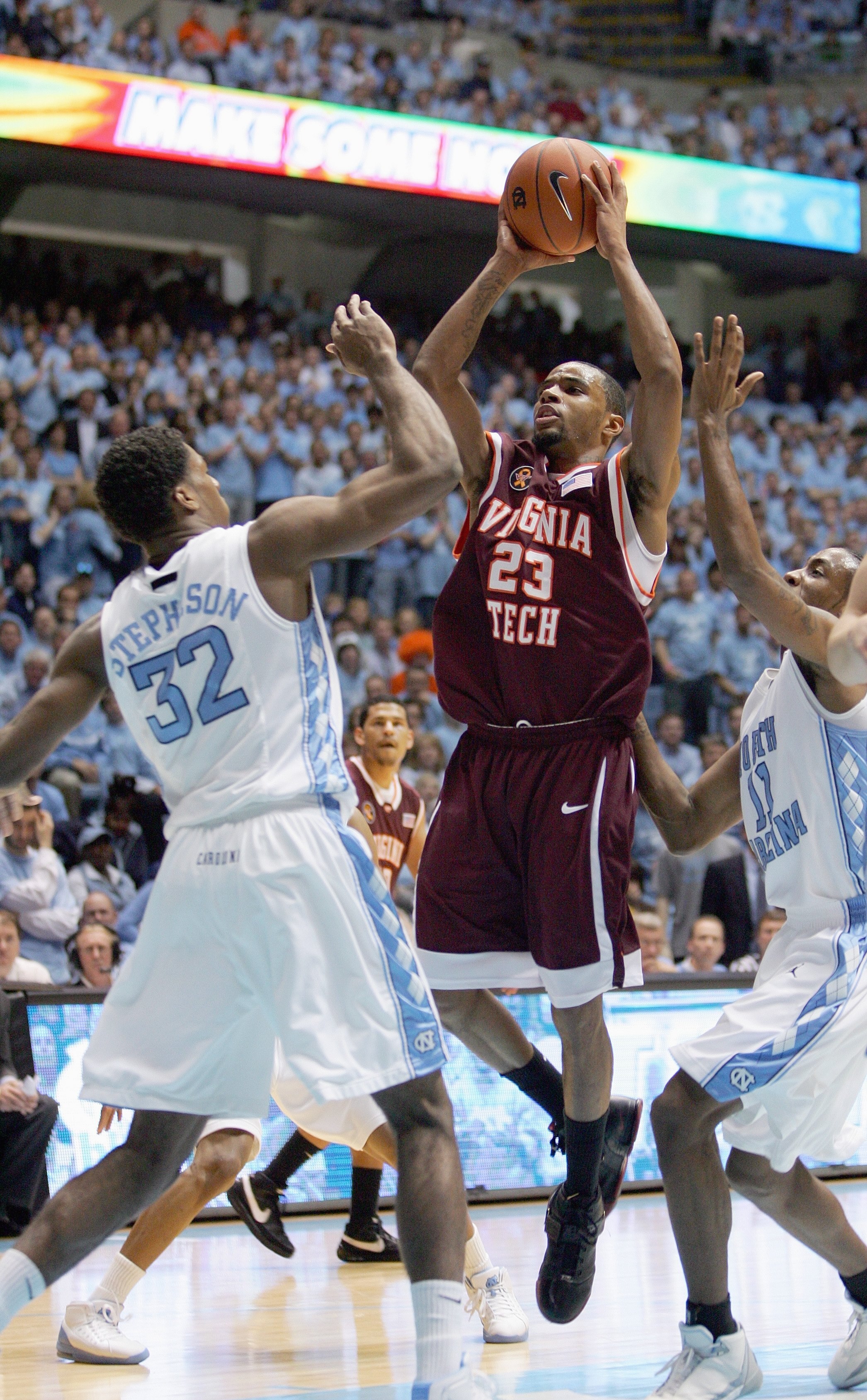CHAPEL HILL - FEBRUARY 16: Malcolm Delaney #23 of the Virginia Tech Hokies takes a shot against Alex Stepheson #32 of the North Carolina Tar Heels at the Dean E. Smith Center on February 16, 2008 in Chapel Hill, North Carolina. (Photo by: Streeter Lecka/G