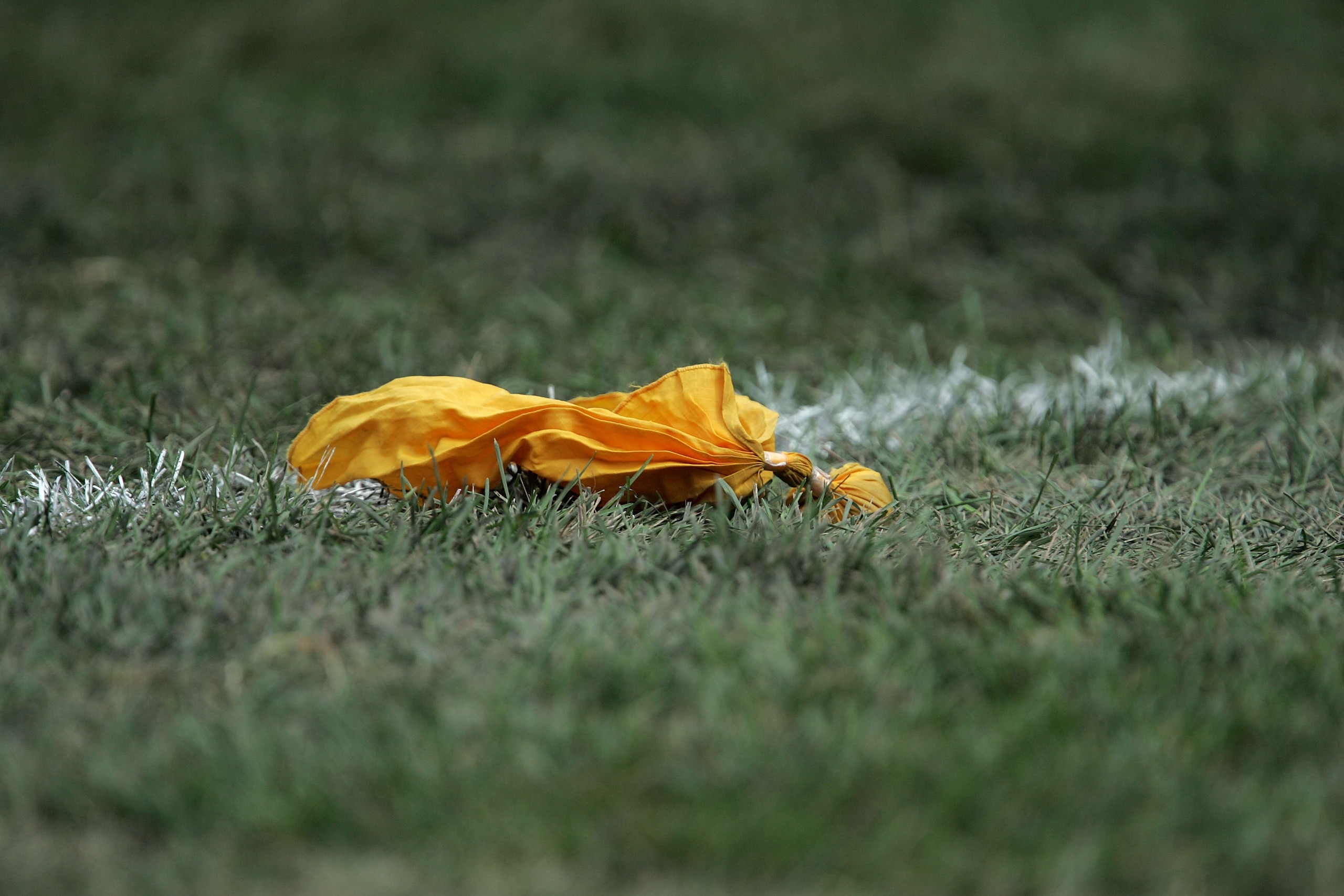 CHICAGO - SEPTEMBER 17:  A yellow penelty flag is seen on the field during the game between the Chicago Bears and the Detroit Lions September 17, 2006 at Soldier Field in Chicago, Illinois. The Bears won 34-7. (Photo by Jonathan Daniel/Getty Images)