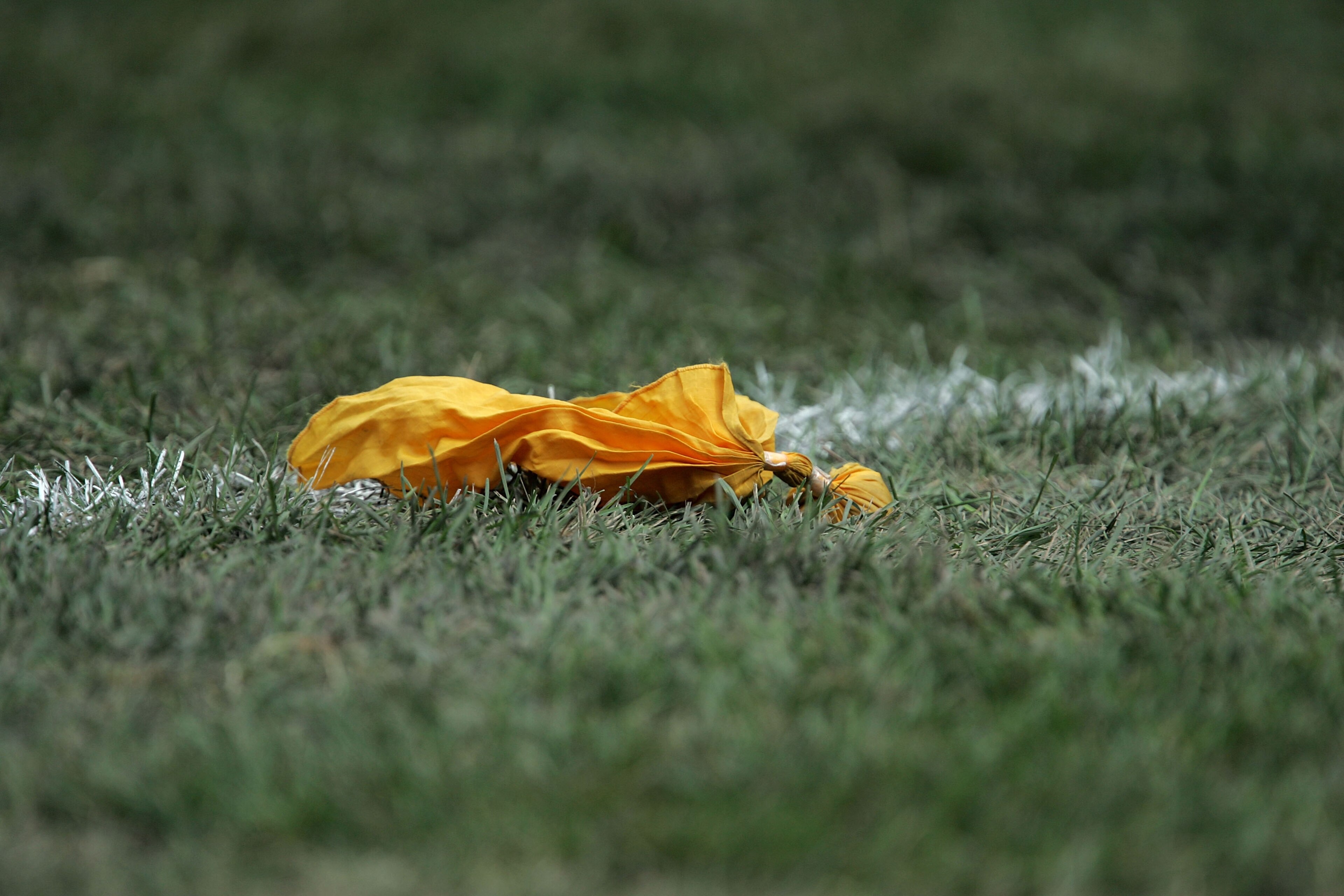CHICAGO - SEPTEMBER 17:  A yellow penelty flag is seen on the field during the game between the Chicago Bears and the Detroit Lions September 17, 2006 at Soldier Field in Chicago, Illinois. The Bears won 34-7. (Photo by Jonathan Daniel/Getty Images)