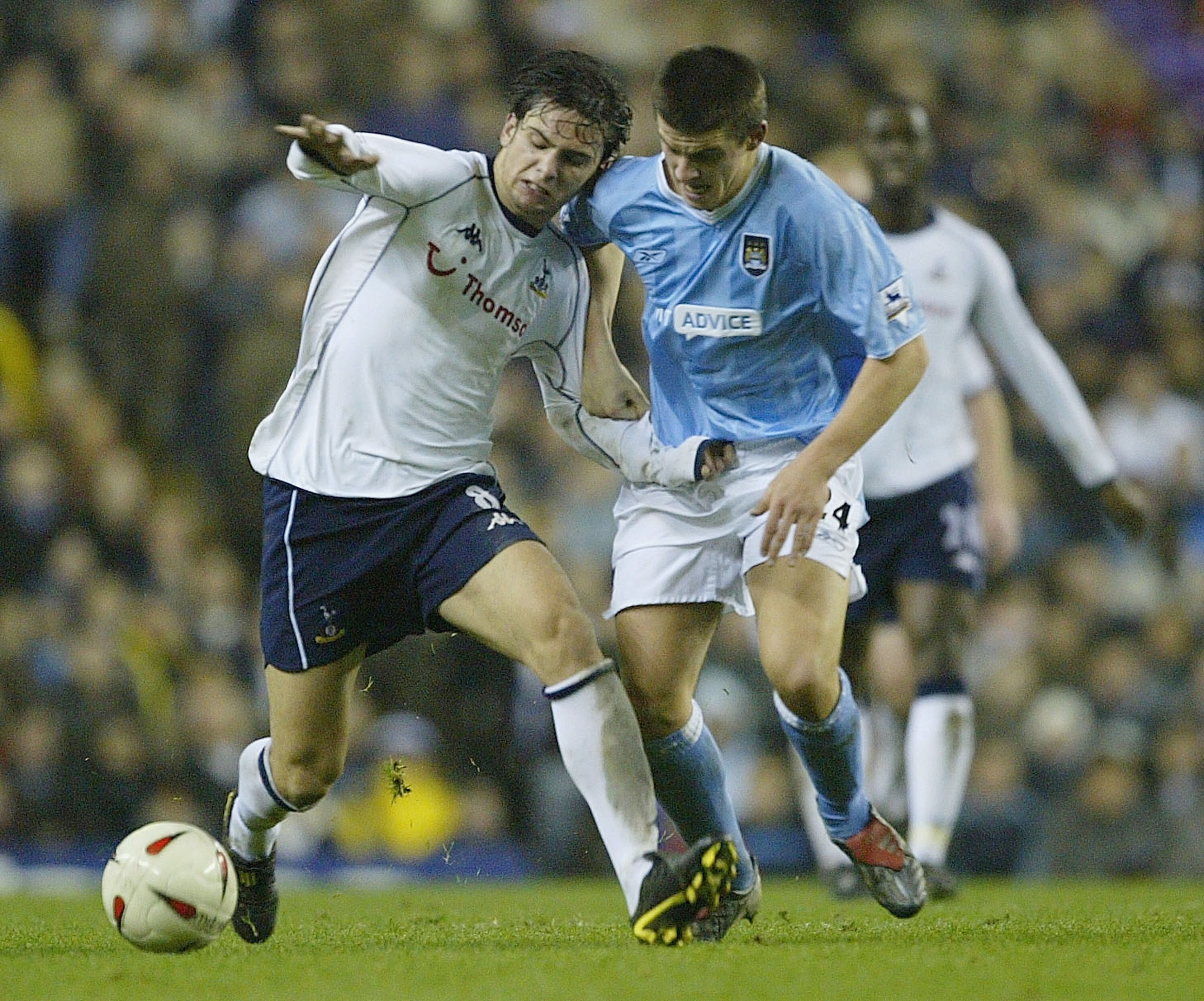LONDON - DECEMBER 3:  Helda Postiga of Tottenham Hotspur is tackled by Joey Barton of Manchester City despairs during the Carling Cup fourth round match between Tottenham Hotspur and Manchester City at White Hart Lane on December 3, 2003 in London.  (Phot