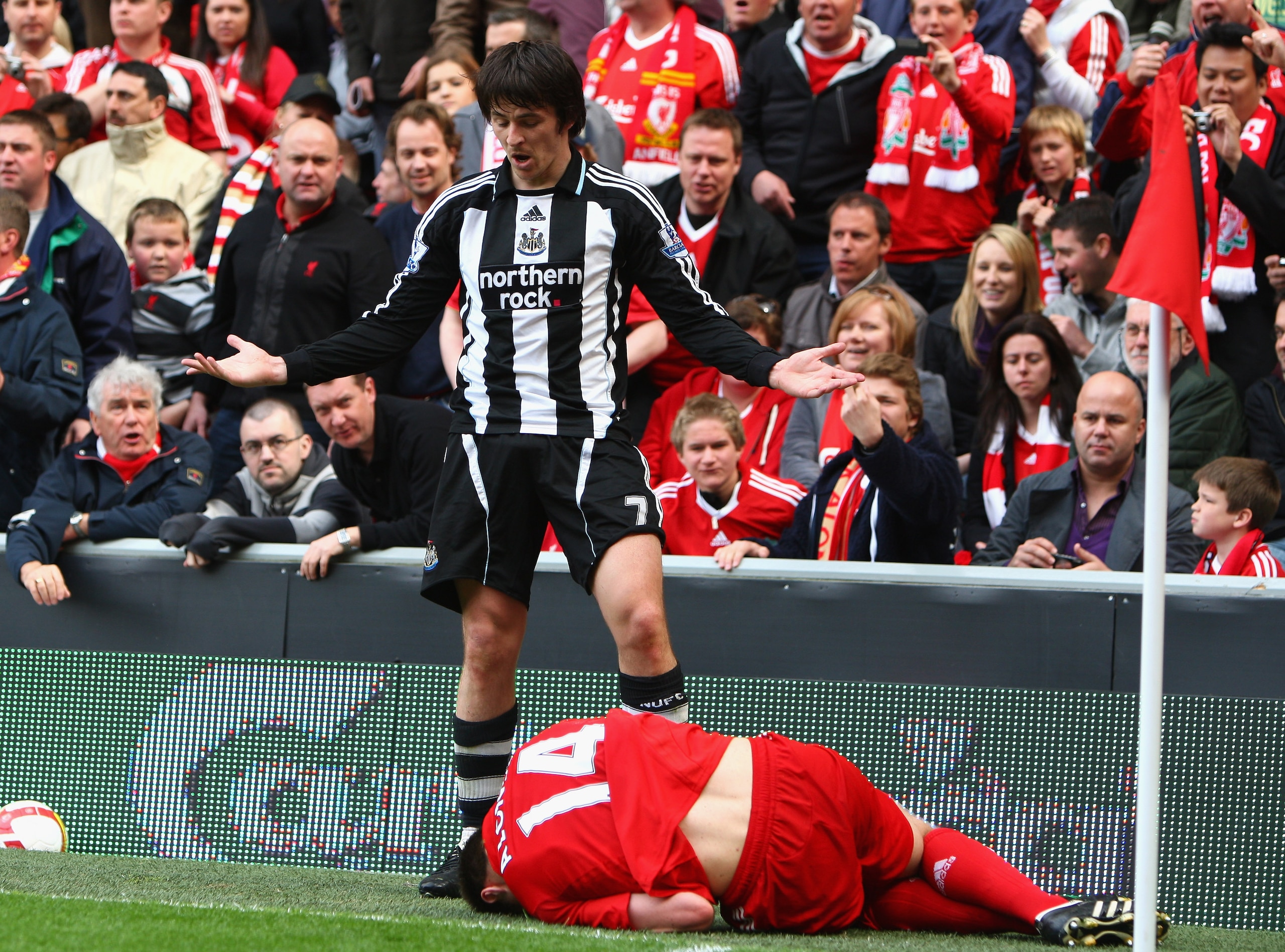 LIVERPOOL, UNITED KINGDOM - MAY 03:  Joey Barton of Newcastle United protests after a challenge on Xabi Alonso of Liverpool and is subsequently sent off by Referee Phil Dowd during the Barclays Premier League match between Liverpool and Newcastle United a