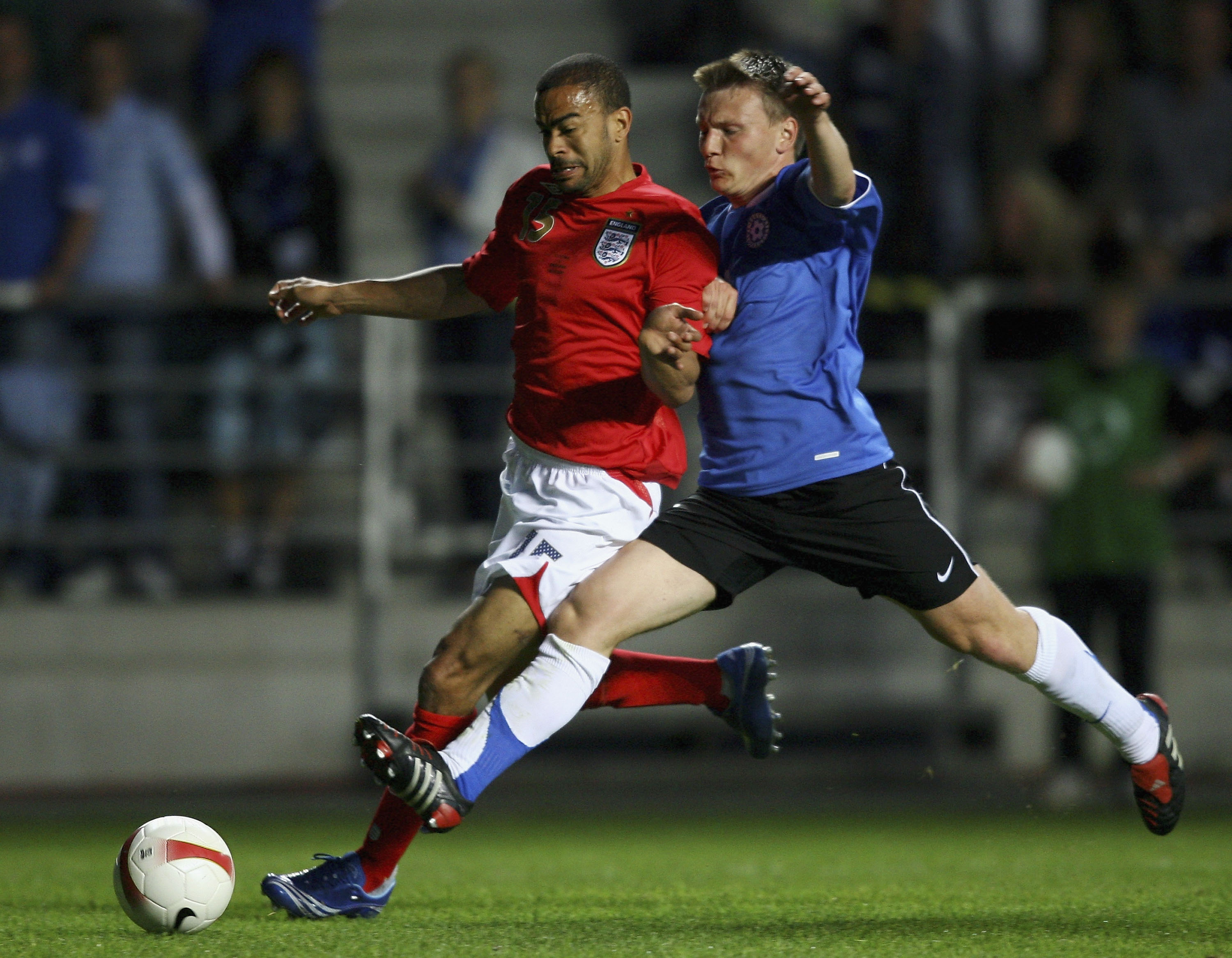 TALLINN, ESTONIA - JUNE 06:  Keiron Dyer of England is challenged by Dmitri Kruglov of Estonia during the Euro2008 Qualifying match between Estonia and England at A. Le Coq Arena on June 6, 2007 in Tallinn, Estonia.  (Photo by Shaun Botterill/Getty Images
