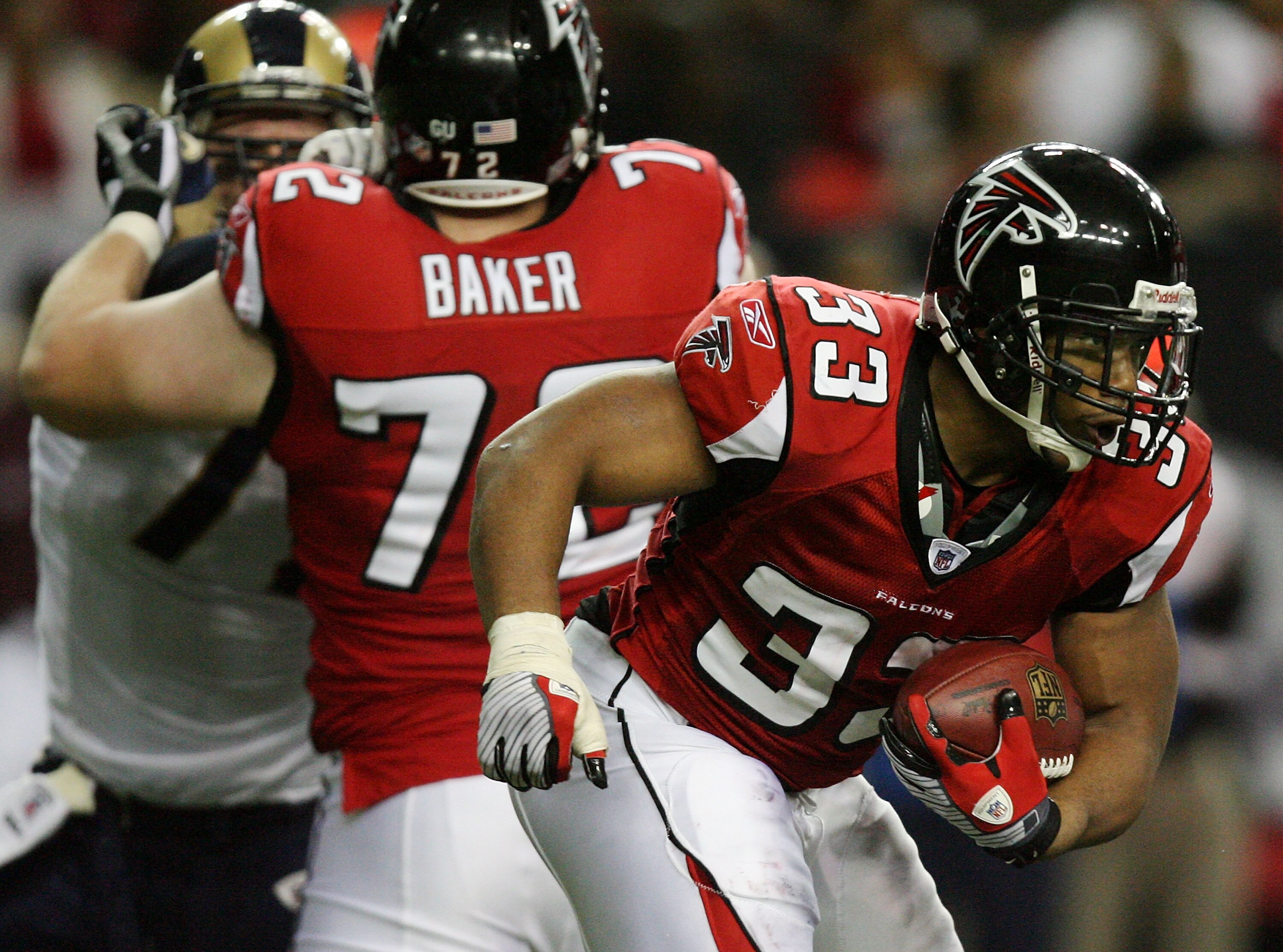 ATLANTA - DECEMBER 28:  Running back Michael Turner #33 of the Atlanta Falcons looks for room to run while taking on the St. Louis Rams at Georgia Dome on December 28, 2008 in Atlanta, Georgia. The Falcons defeated the Rams 31-27.  (Photo by Doug Benc/Get