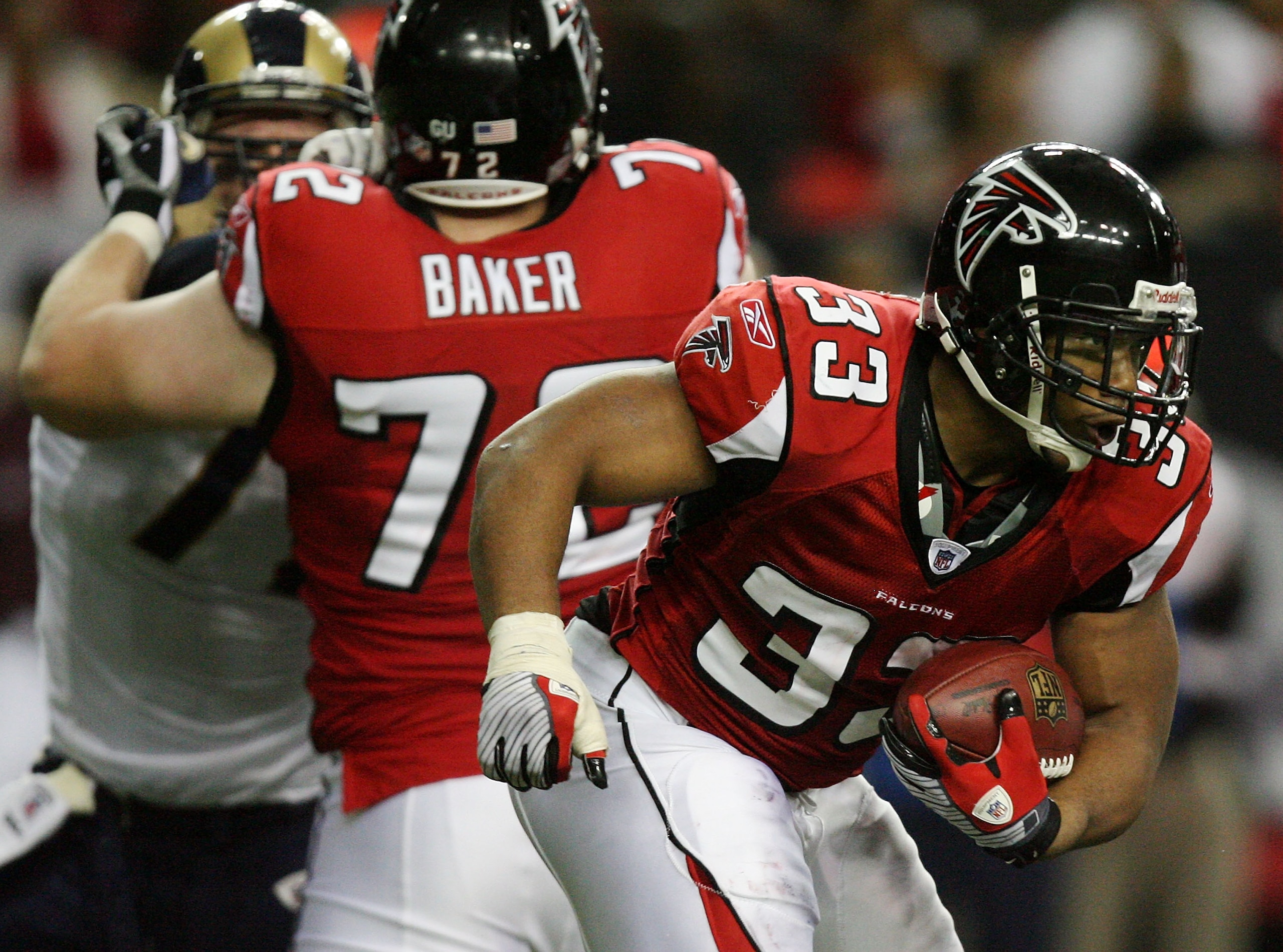 ATLANTA - DECEMBER 28:  Running back Michael Turner #33 of the Atlanta Falcons looks for room to run while taking on the St. Louis Rams at Georgia Dome on December 28, 2008 in Atlanta, Georgia. The Falcons defeated the Rams 31-27.  (Photo by Doug Benc/Get