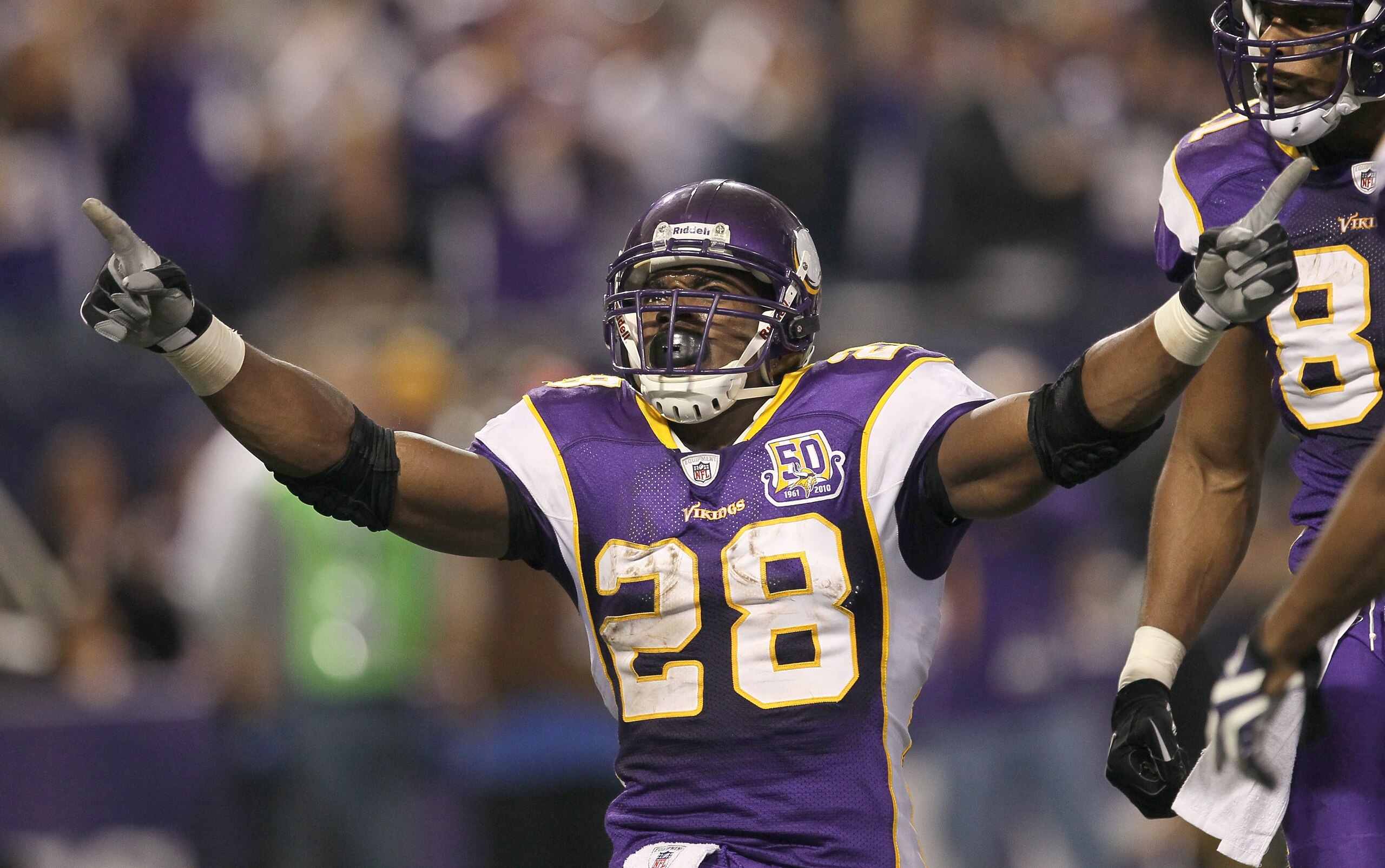 MINNEAPOLIS - NOVEMBER 7: Running back Adrian Peterson #28 of the Minnesota Vikings celebrates after his four yard touchdown run brought the Vikings within a touchdown of the Arizona Cardinals in the fourth quarter at Hubert H. Humphrey Metrodome on Novem