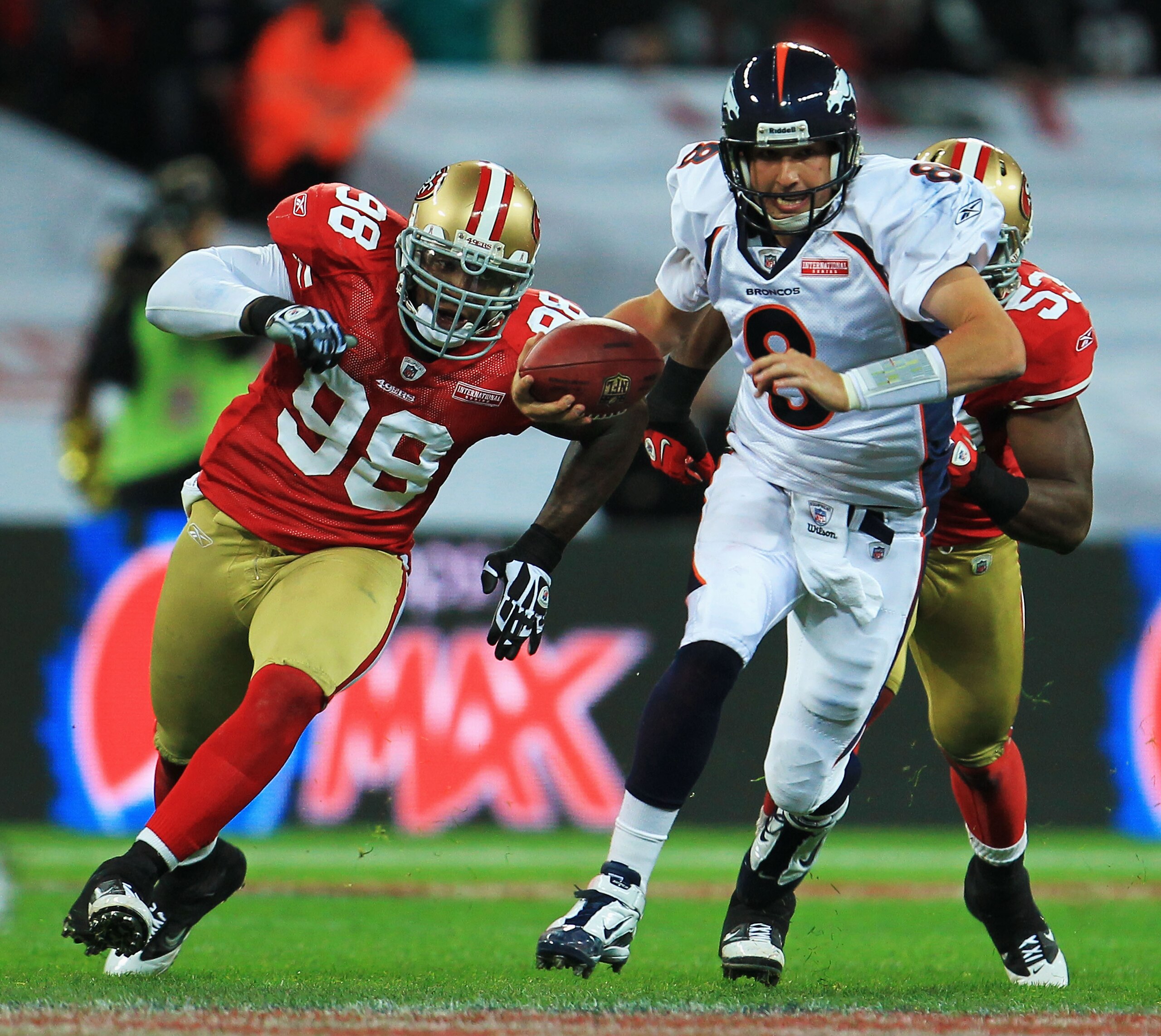 LONDON, ENGLAND - OCTOBER 31: Kyle Orton #8 of Denver Broncos is chased by Parys Haralston #98 and NaVorro Sopoaga #53 of San Francisco 49ers during the NFL International Series match between Denver Broncos and San Francisco 49ers at Wembley Stadium on O LONDON, ENGLAND - OCTOBER 31: Kyle Orton #8 of Denver Broncos is chased by Parys Haralston #98 and NaVorro Sopoaga #53 of San Francisco 49ers during the NFL International Series match between Denver Broncos and San Francisco 49ers at Wembley Stadium on O