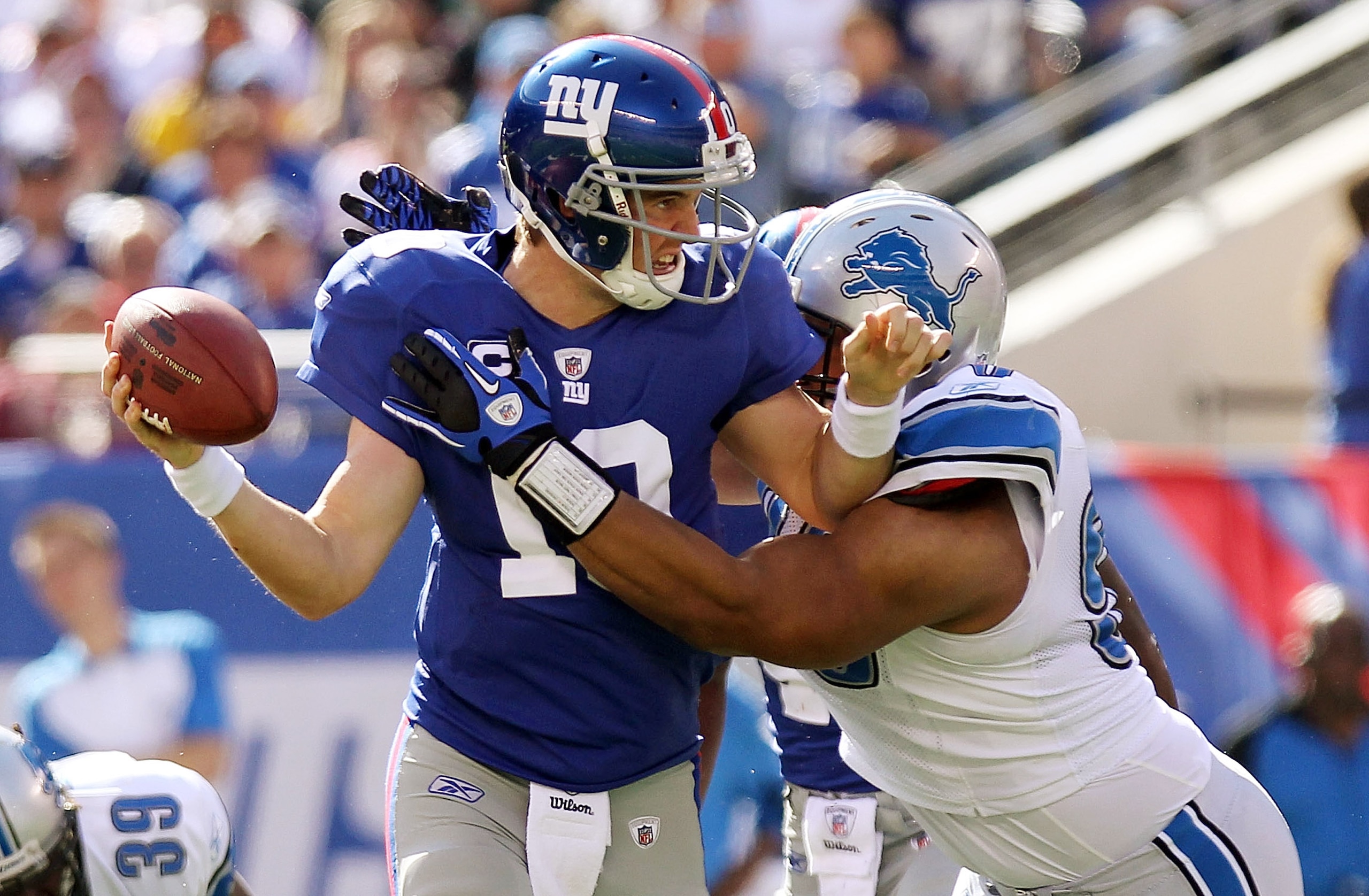 EAST RUTHERFORD, NJ - OCTOBER 17:  Eli Manning #10 of the New York Giants is sacked by Ndamukong Suh #90 of the Detroit Lions at New Meadowlands Stadium on October 17, 2010 in East Rutherford, New Jersey.  (Photo by Nick Laham/Getty Images)