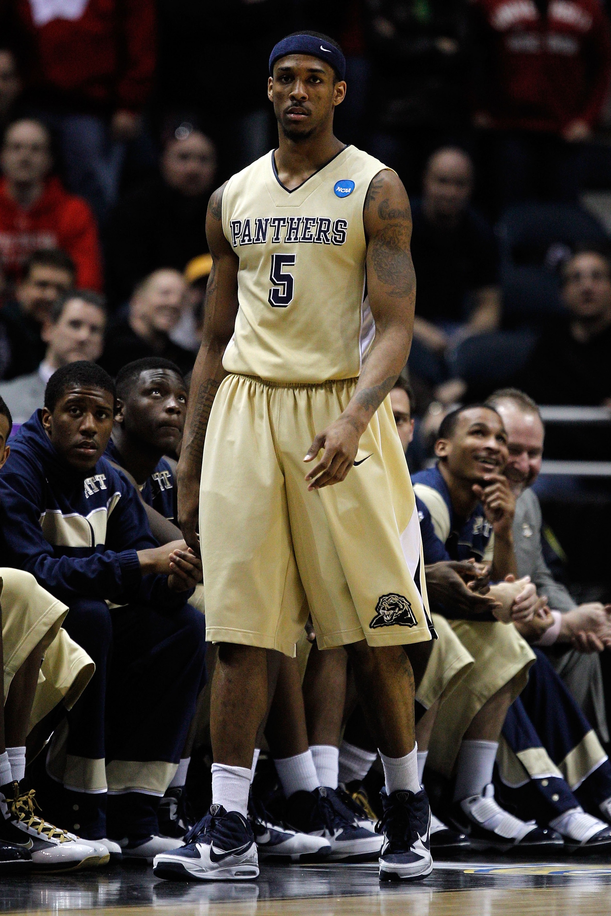 MILWAUKEE - MARCH 21: Gilbert Brown #5 of the Pittsburgh Panthers walks by the Panthers bench against the Xavier Musketeers during the second round of the 2010 NCAA men's basketball tournament at the Bradley Center on March 21, 2010 in Milwaukee, Wiscons MILWAUKEE - MARCH 21: Gilbert Brown #5 of the Pittsburgh Panthers walks by the Panthers bench against the Xavier Musketeers during the second round of the 2010 NCAA men's basketball tournament at the Bradley Center on March 21, 2010 in Milwaukee, Wiscons