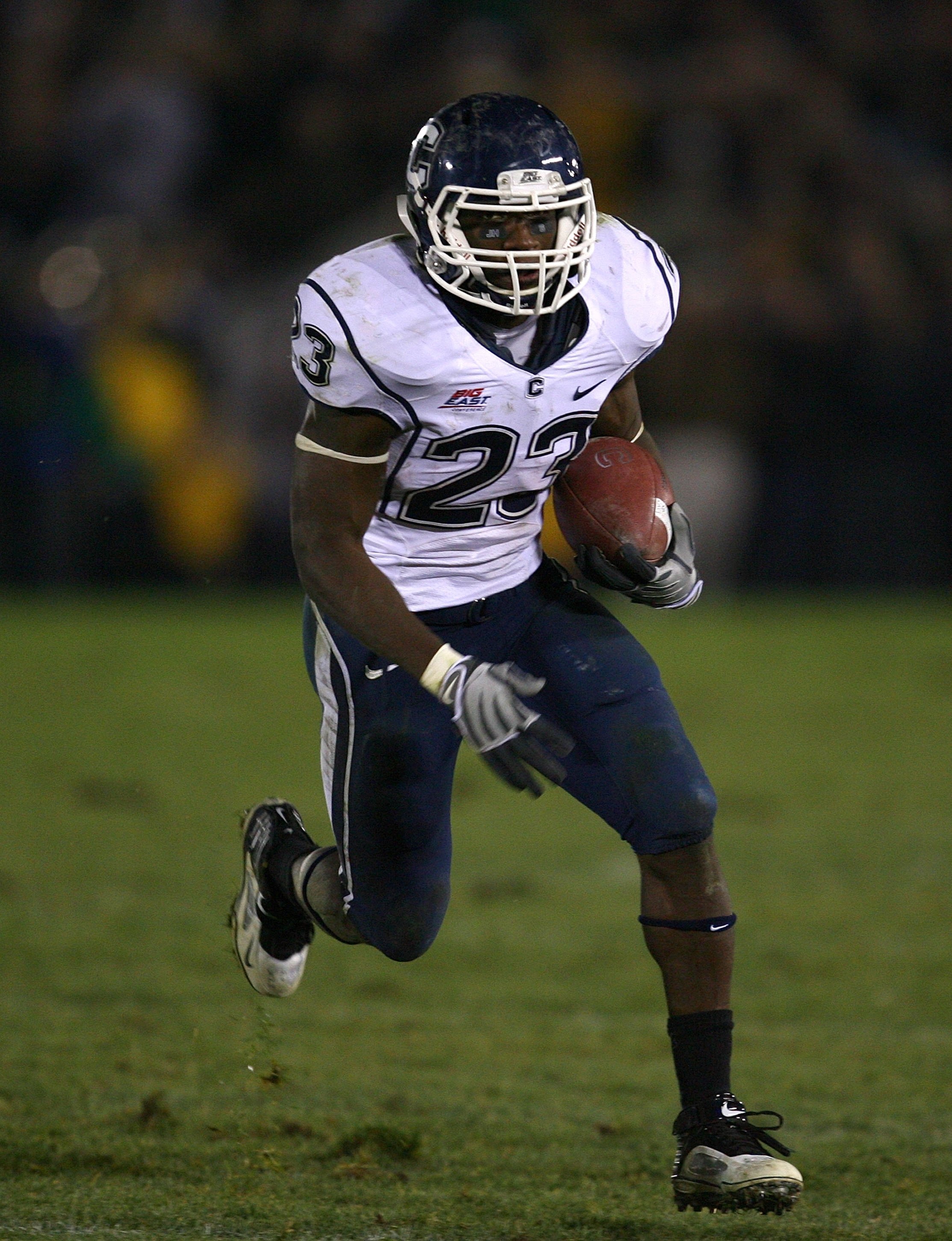 SOUTH BEND, IN - NOVEMBER 21: Jordan Todman #23 of the Univeristy of Connecticut Huskies runs with the ball against the Notre Dame Fighting Irish at Notre Dame Stadium on November 21, 2009 in South Bend, Indiana. Connecticut defeated Notre Dame 33-30 in o
