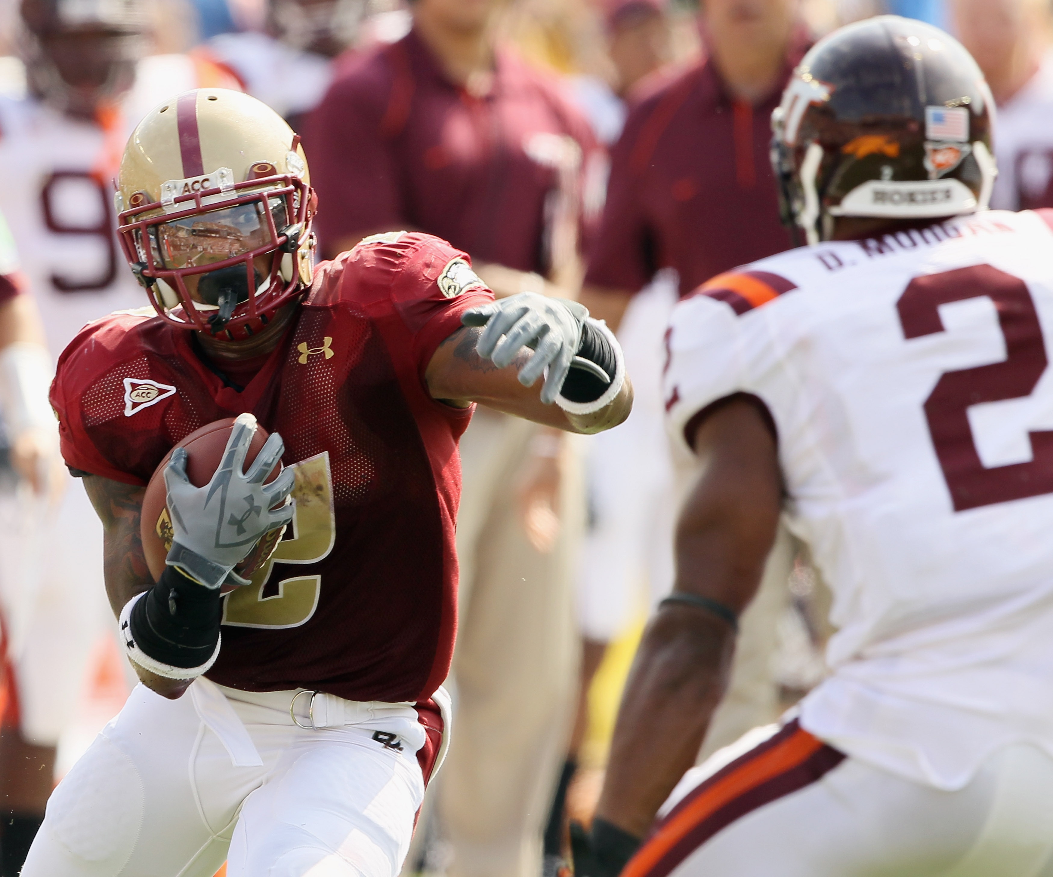 CHESTNUT HILL, MA - SEPTEMBER 25:  Montel Harris #2 of the Boston College Eagles carries the ball and tries to manuever around Davon Morgan #2 of the Virginia Tech Hokies on September 25, 2010 at Alumni Stadium in Chestnut Hill, Massachusetts.  (Photo by