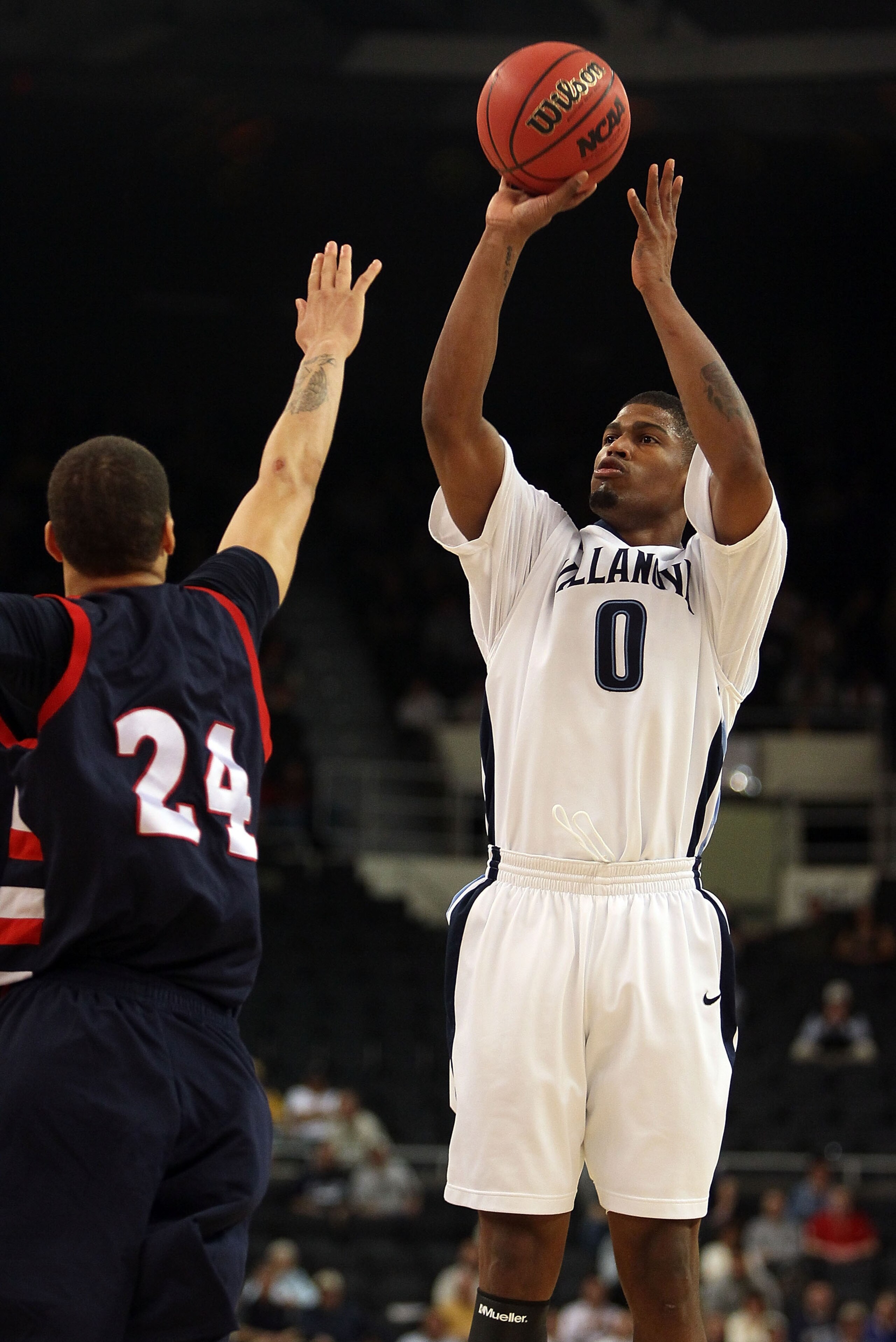 PROVIDENCE, RI - MARCH 18: Antonio Pena #0 of the Villanova Wildcats takes a shot as Dallas Green #24 of the Robert Morris Colonials defends during the first round of the 2010 NCAA men's basketball tournament on March 18, 2010 at the Dunkin Donuts Arena PROVIDENCE, RI - MARCH 18: Antonio Pena #0 of the Villanova Wildcats takes a shot as Dallas Green #24 of the Robert Morris Colonials defends during the first round of the 2010 NCAA men's basketball tournament on March 18, 2010 at the Dunkin Donuts Arena