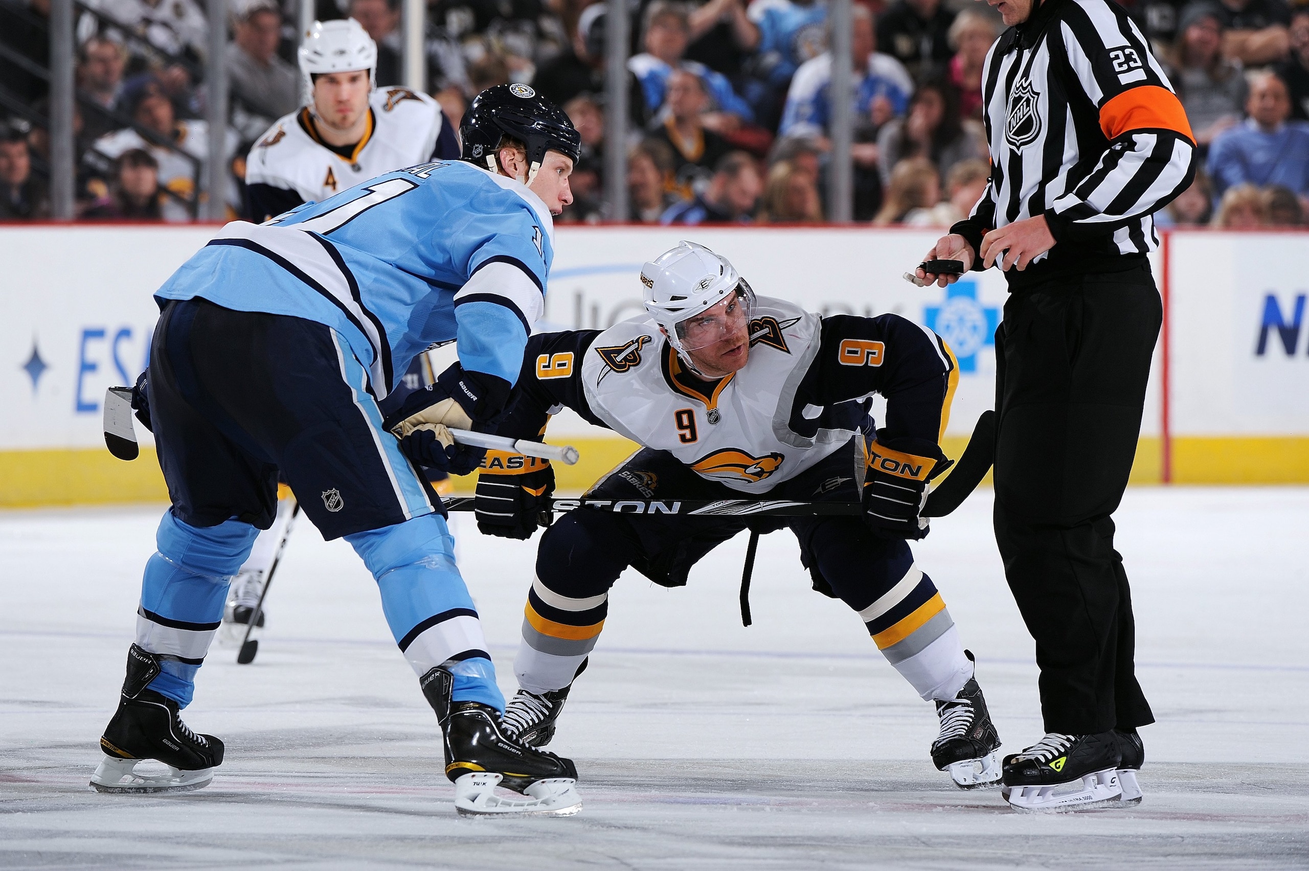 PITTSBURGH - FEBRUARY 1:  Forwards Jordan Stall #11 of the Pittsburgh Penguins and Derek Roy #9 of the Buffalo Sabres wait to take a face off on February 1, 2010 at Mellon Arena in Pittsburgh, Pennsylvania.  (Photo by Jamie Sabau/Getty Images)
