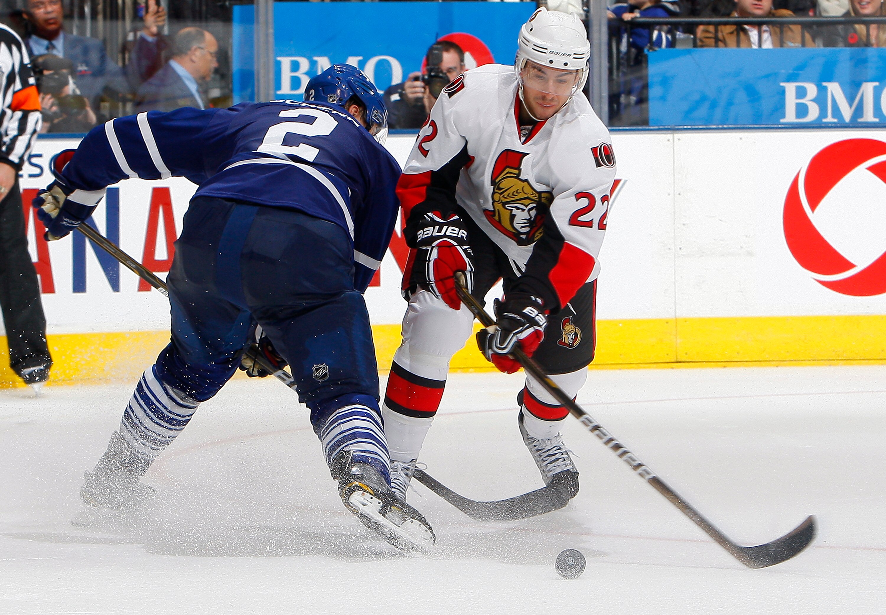 TORONTO - NOVEMBER 2: Luke Schenn #2 of the Toronto Maple Leafs skates into Chris Kelly #22 of the Ottawa Senators during NHL action at the Air Canada Centre November 2, 2010 in Toronto, Ontario, Canada. (Photo by Abelimages/Getty Images)