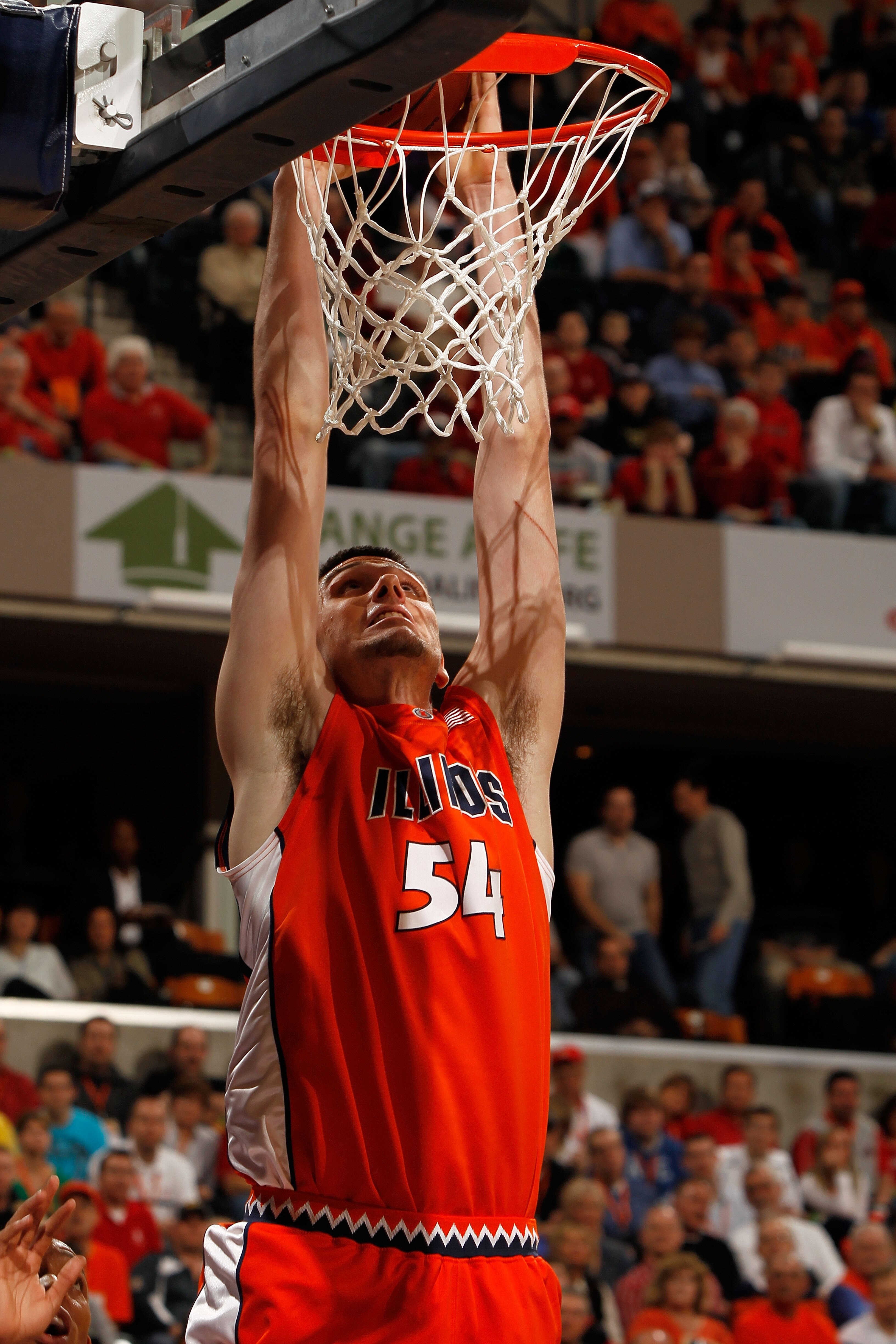 INDIANAPOLIS - MARCH 13:  Center Mike Tisdale #54 of the Illinois Fighting Illini dunks the ball against the Ohio State Buckeyes in the semifinals of the Big Ten Men's Basketball Tournament at Conseco Fieldhouse on March 13, 2010 in Indianapolis, Indiana.