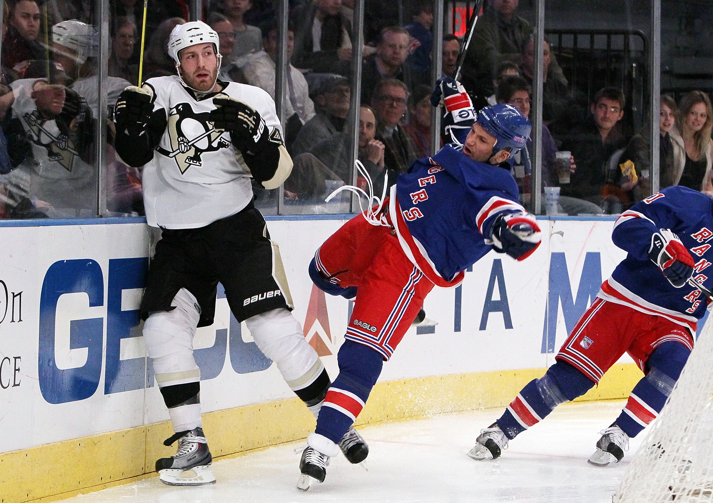 NEW YORK - MARCH 04:  Brooks Orpik #44 of the Pittsburgh Penguins fends off Sean Avery #16 of the New York Rangers on March 4, 2010 at Madison Square Garden in New York City.  (Photo by Jim McIsaac/Getty Images)