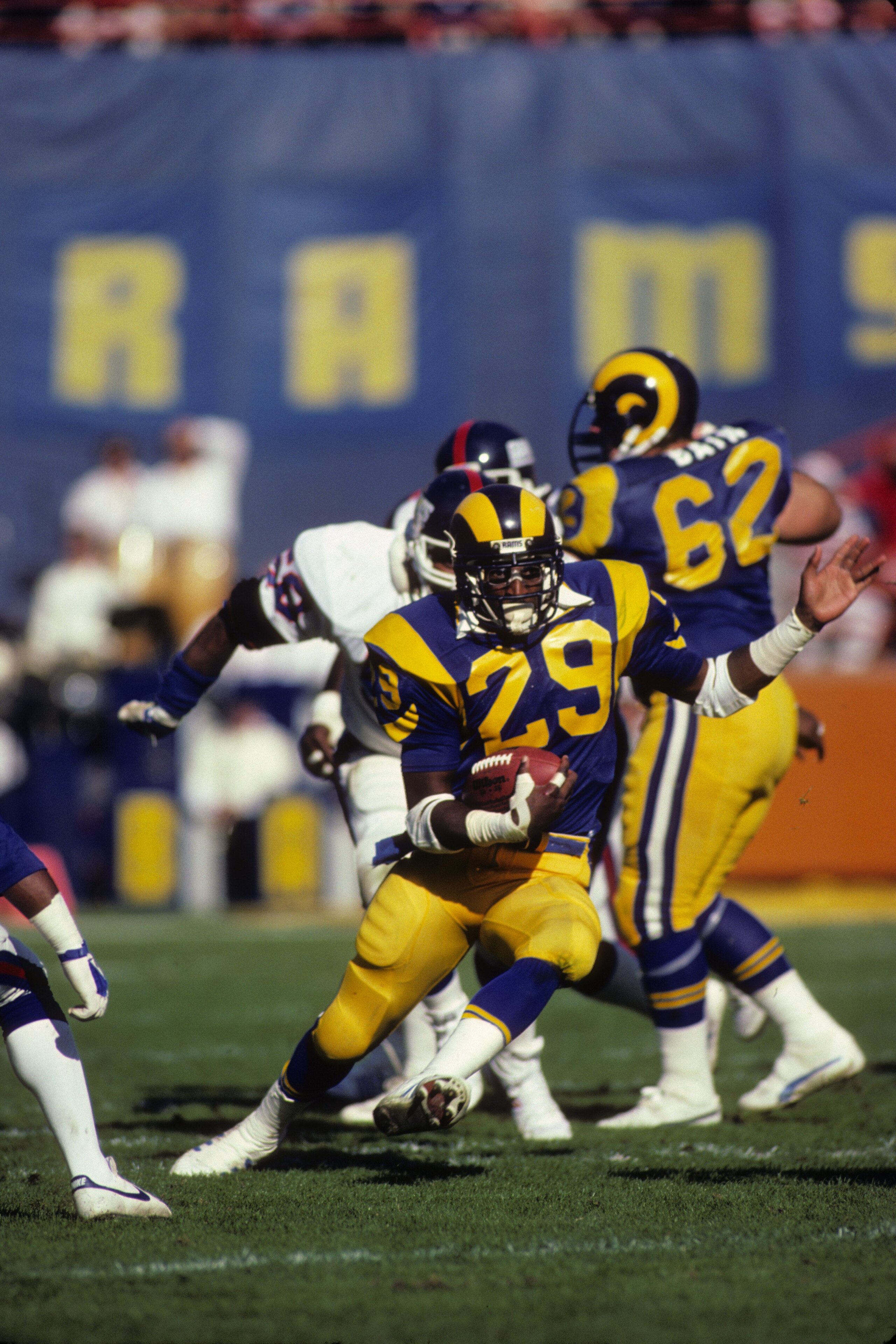 ANAHEIM, CA - DECEMBER 23:  Running back Eric Dickerson #29 of the Los Angeles Rams looks for room to run against the New York Giants during the 1984 NFC Wild Card playoff game at Anaheim Stadium on December 23, 1984 in Anaheim, California.   The Giants w