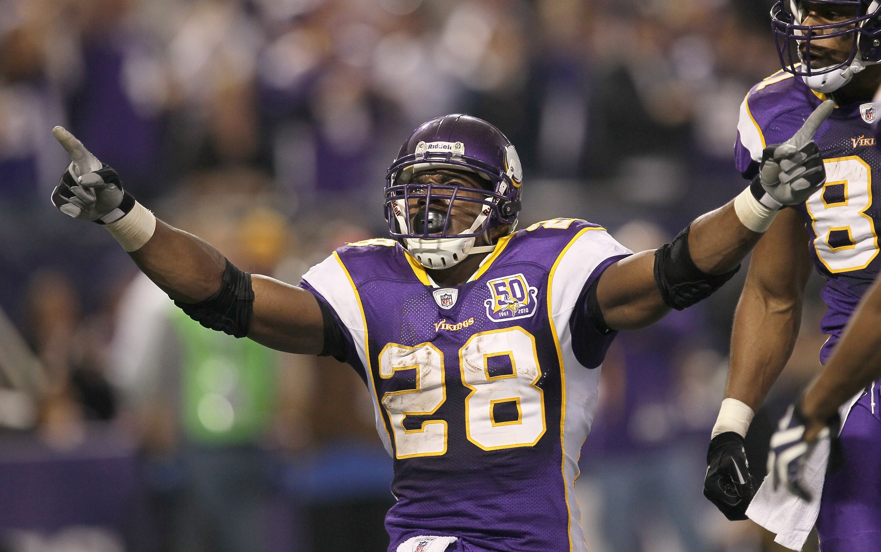 MINNEAPOLIS - NOVEMBER 7: Running back Adrian Peterson #28 of the Minnesota Vikings celebrates after his four yard touchdown run brought the Vikings within a touchdown of the Arizona Cardinals in the fourth quarter at Hubert H. Humphrey Metrodome on Novem