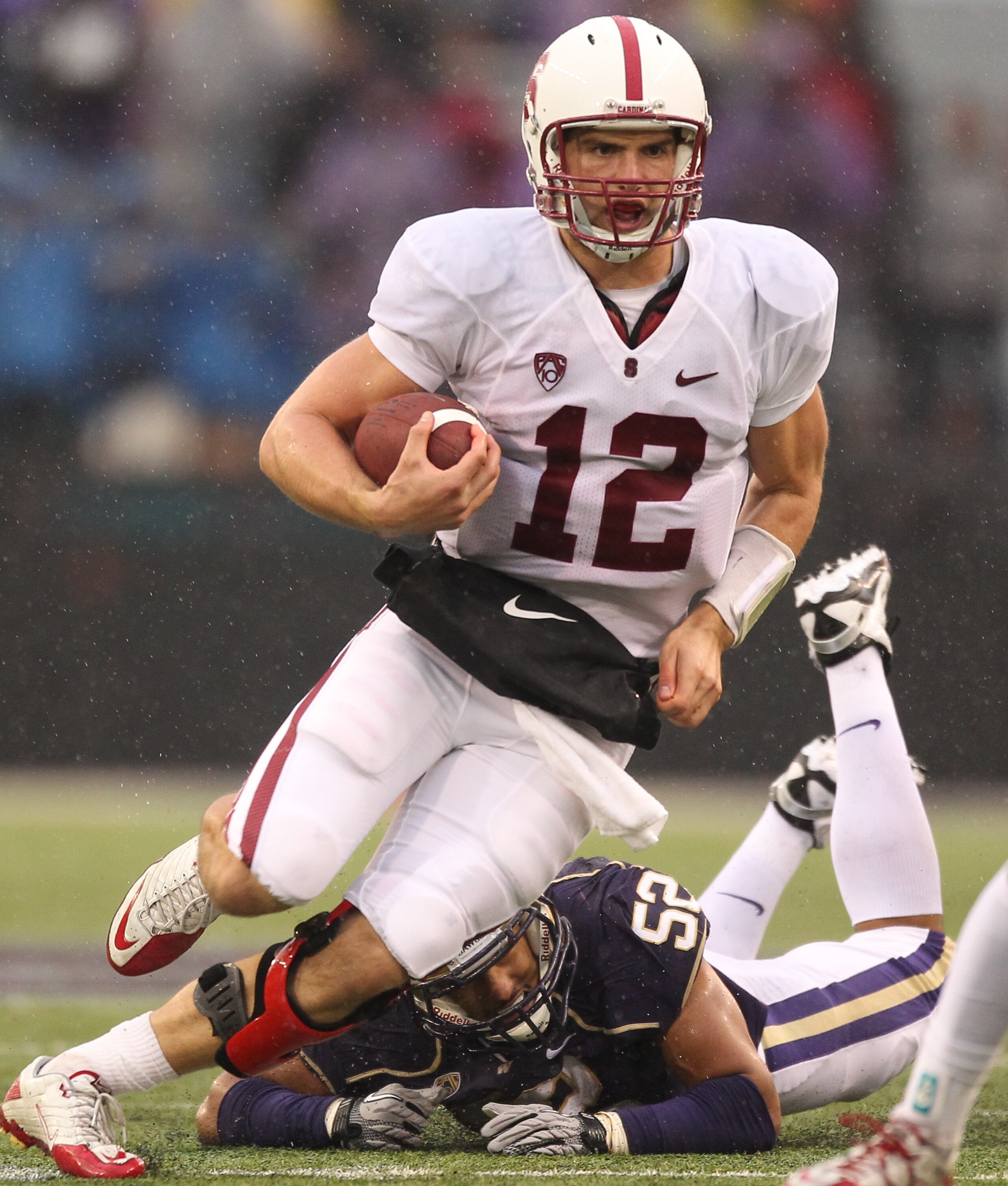 SEATTLE - OCTOBER 30:  Quarterback Andrew Luck #12 of the Stanford Cardinal rushes against the Washington Huskies on October 30, 2010 at Husky Stadium in Seattle, Washington. Stanford won 41-0. (Photo by Otto Greule Jr/Getty Images)