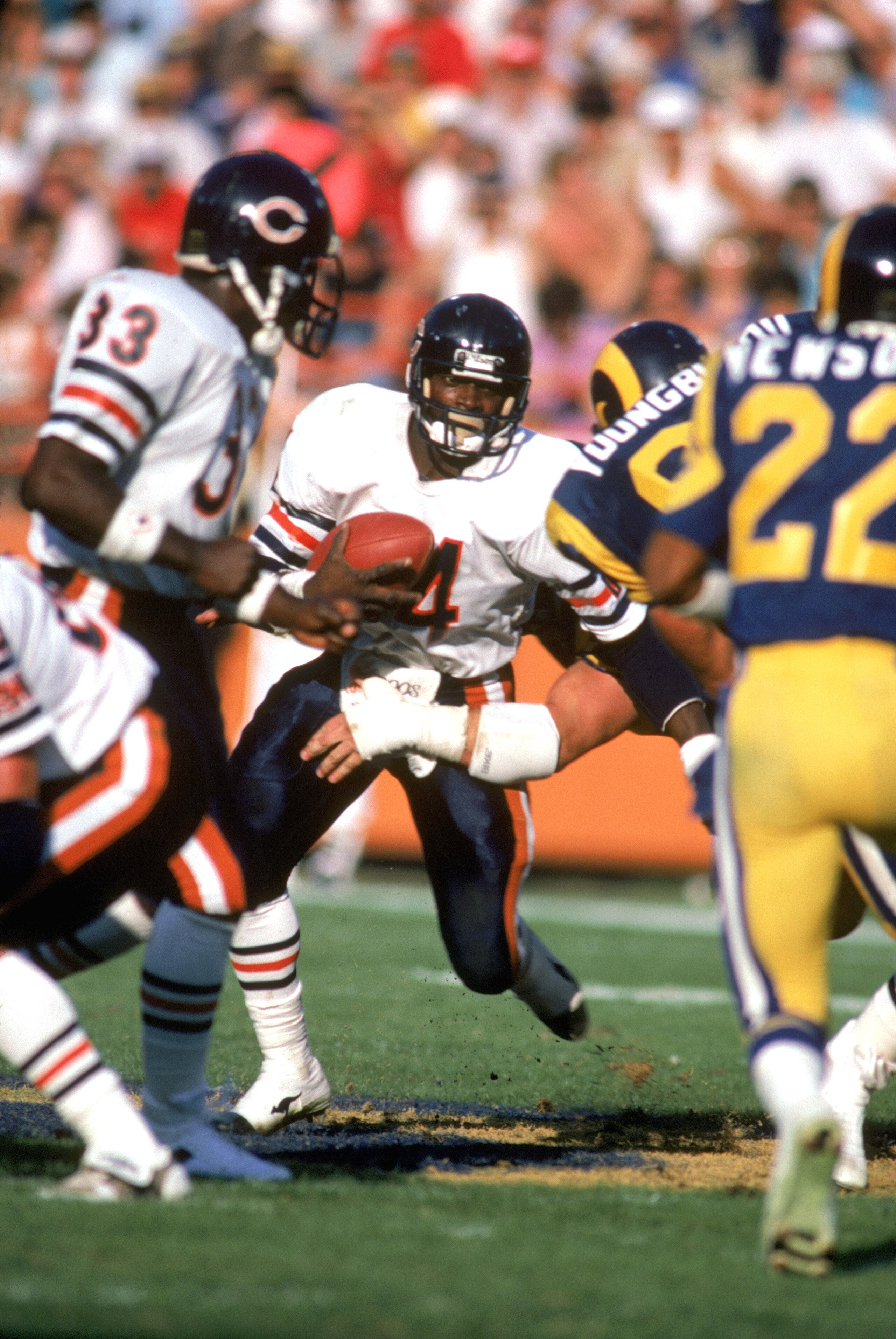 ANAHEIM, CA - 1978:  Running back Walter Payton #34 of the Chicago Bears runs with the ball against the Los Angeles Rams during a game in the 1978 NFL season at Anaheim Stadium in Anaheim, California. (Photo by Tony Duffy/Getty Images)