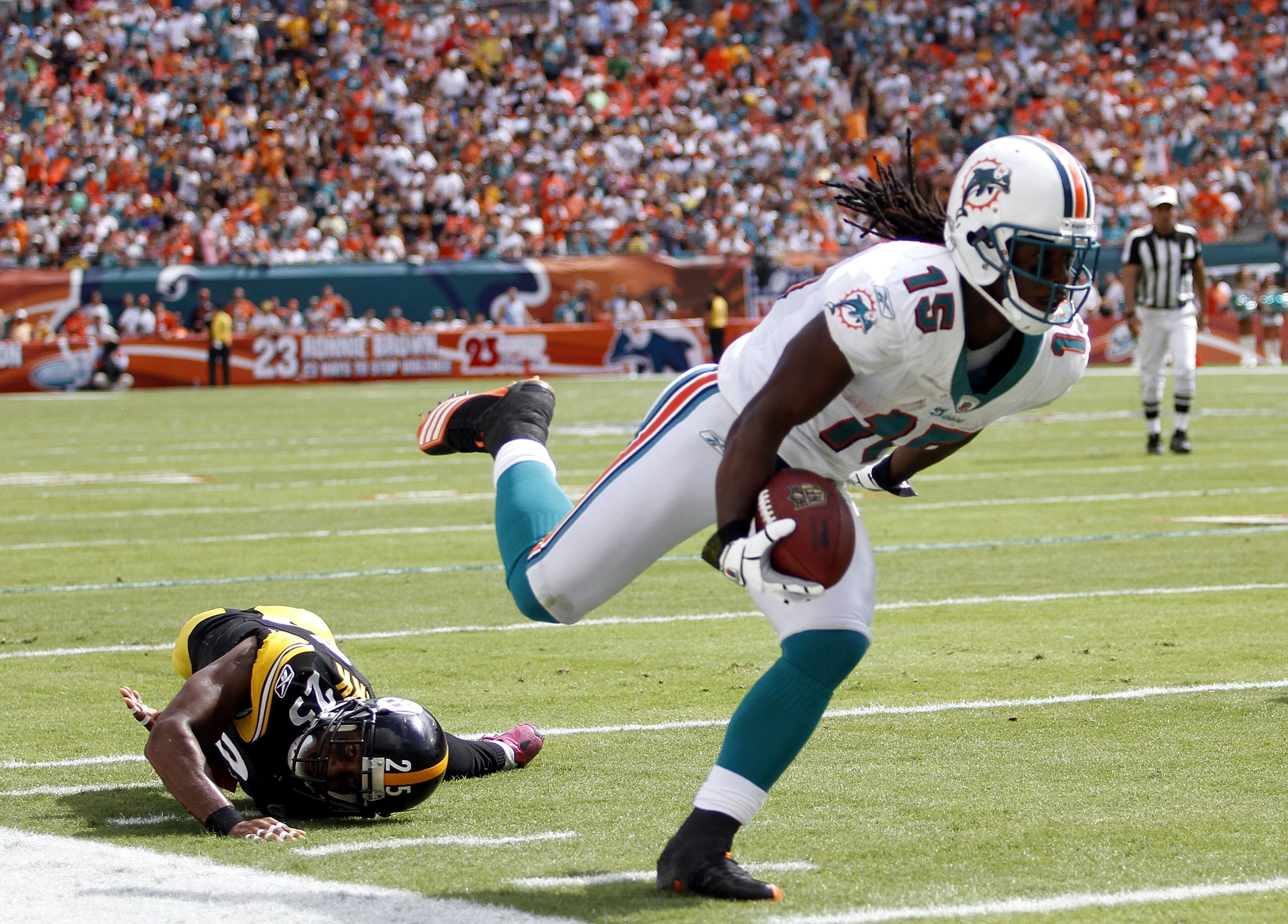 MIAMI - OCTOBER 24: Receiver Davone Bess #15 scores a touchdown against linebacker Lawrence Timmons #94 of the Pittsburgh Steelers at Sun Life Stadium on October 24, 2010 in Miami, Florida. (Photo by Marc Serota/Getty Images) MIAMI - OCTOBER 24: Receiver Davone Bess #15 scores a touchdown against linebacker Lawrence Timmons #94 of the Pittsburgh Steelers at Sun Life Stadium on October 24, 2010 in Miami, Florida. (Photo by Marc Serota/Getty Images)