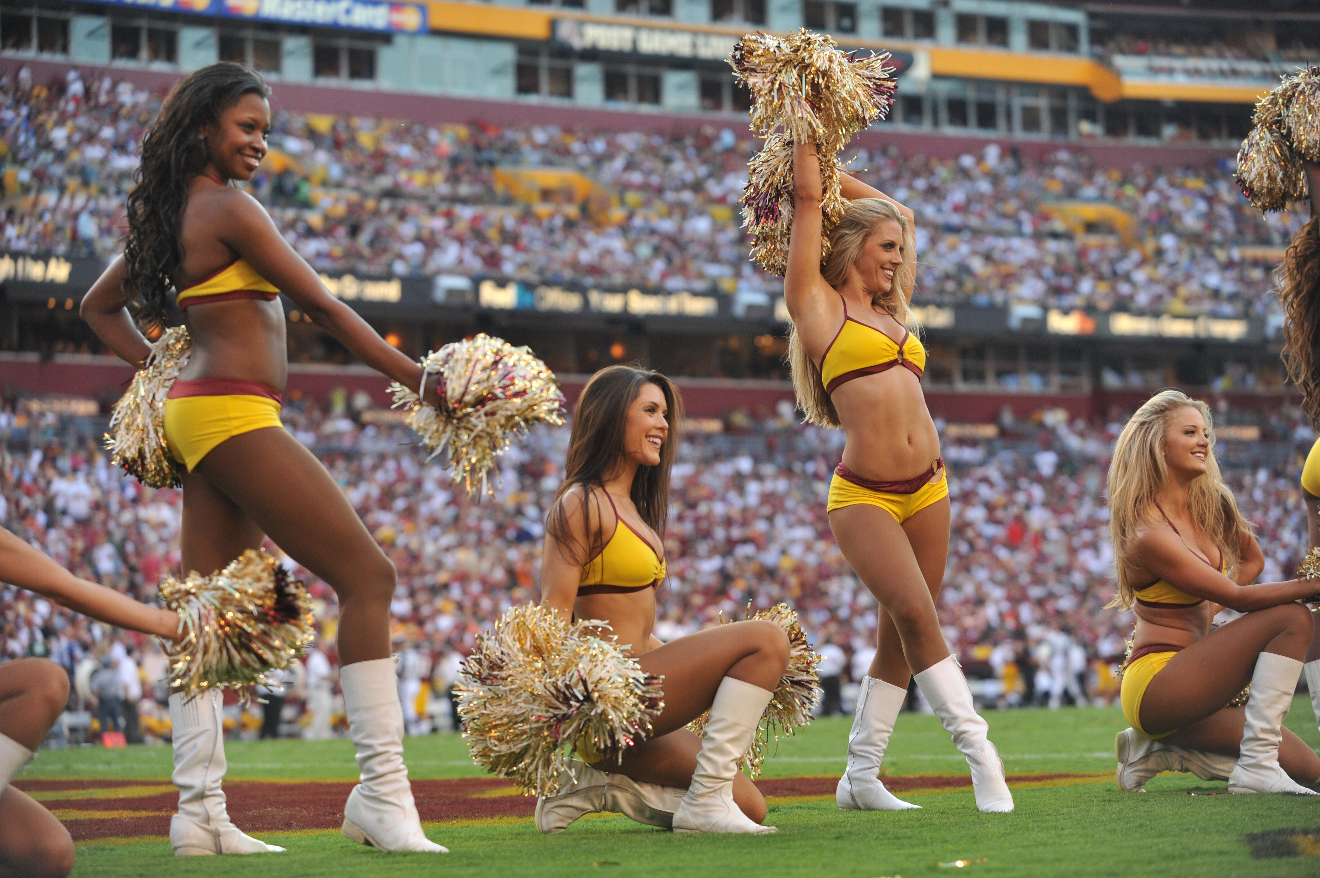 LANDOVER - SEPTEMBER 19:  Cheerleaders for the Washington Redskins cheer during the game against the Houston Texans at FedExField on September 19, 2010 in Landover, Maryland. The Texans defeated the Redskins in overtime 30-27. (Photo by Larry French/Getty