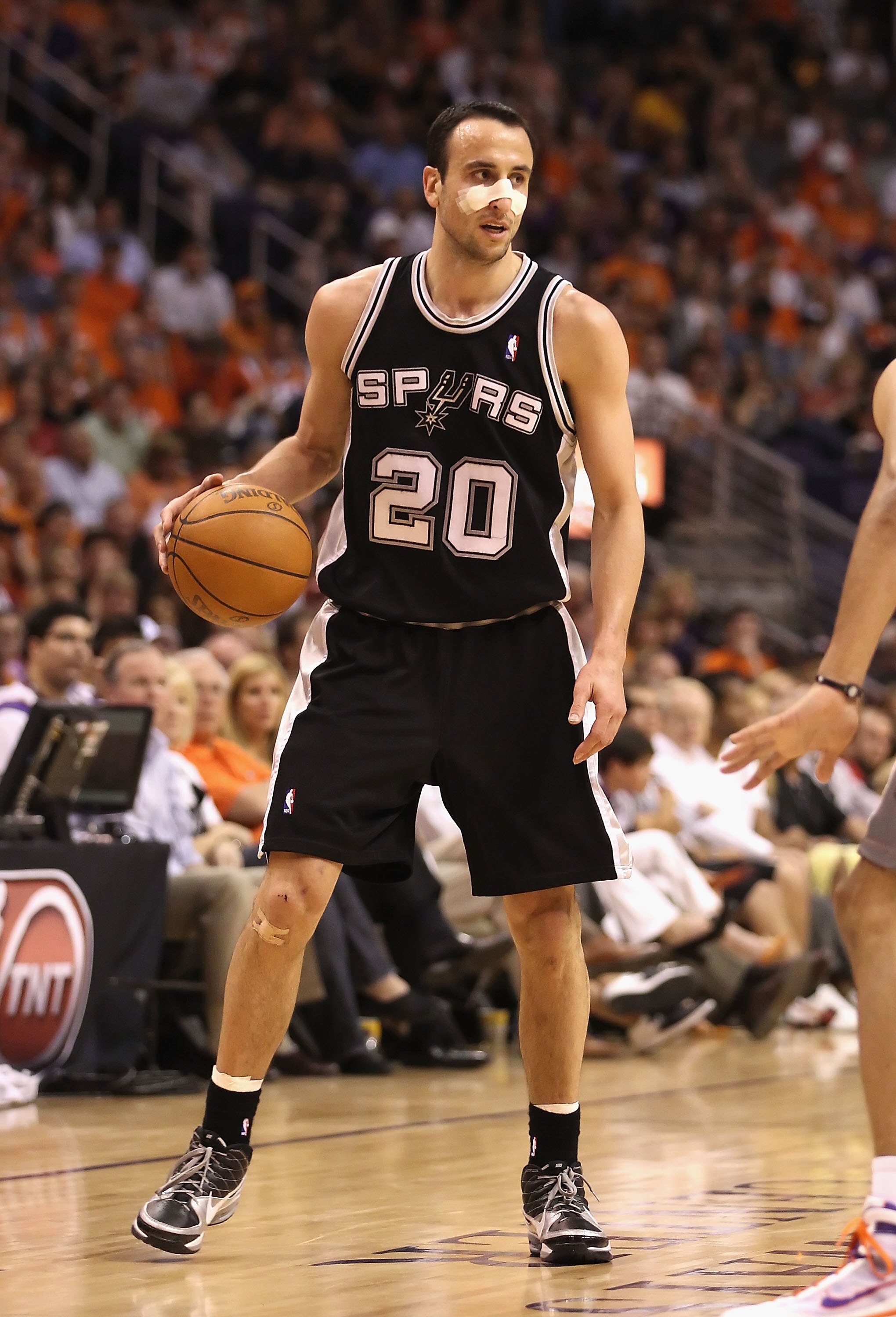 PHOENIX - MAY 05:  Manu Ginobili #20 of the San Antonio Spurs handles the ball during Game Two of the Western Conference Semifinals of the 2010 NBA Playoffs against the Phoenix Suns at US Airways Center on May 5, 2010 in Phoenix, Arizona. The team is wear