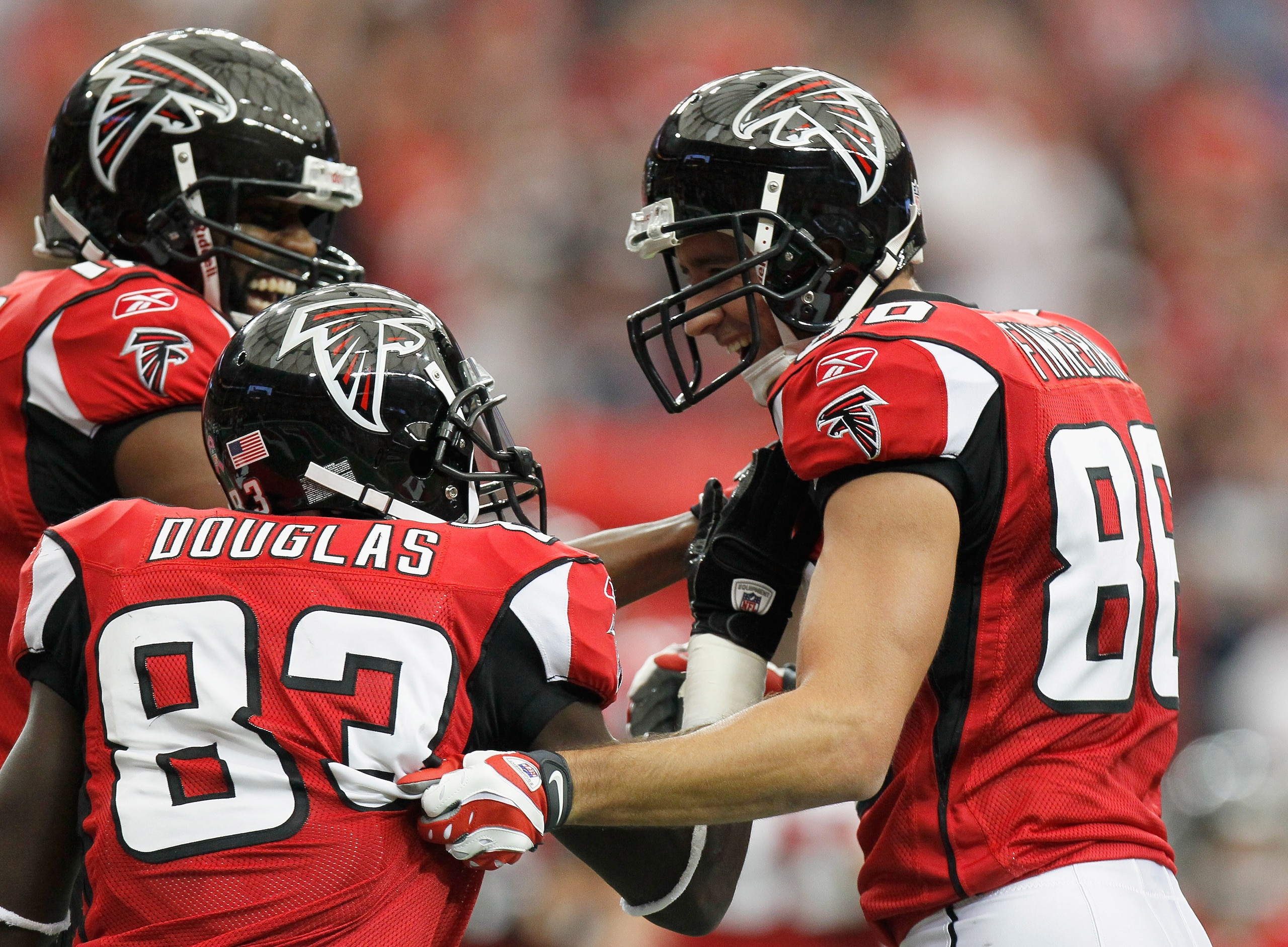 ATLANTA - OCTOBER 24:  Brian Finneran #86 of the Atlanta Falcons celebrates his touchdown against the Cincinnati Bengals with Harry Douglas #83 and Michael Jenkins #12 at Georgia Dome on October 24, 2010 in Atlanta, Georgia.  (Photo by Kevin C. Cox/Getty