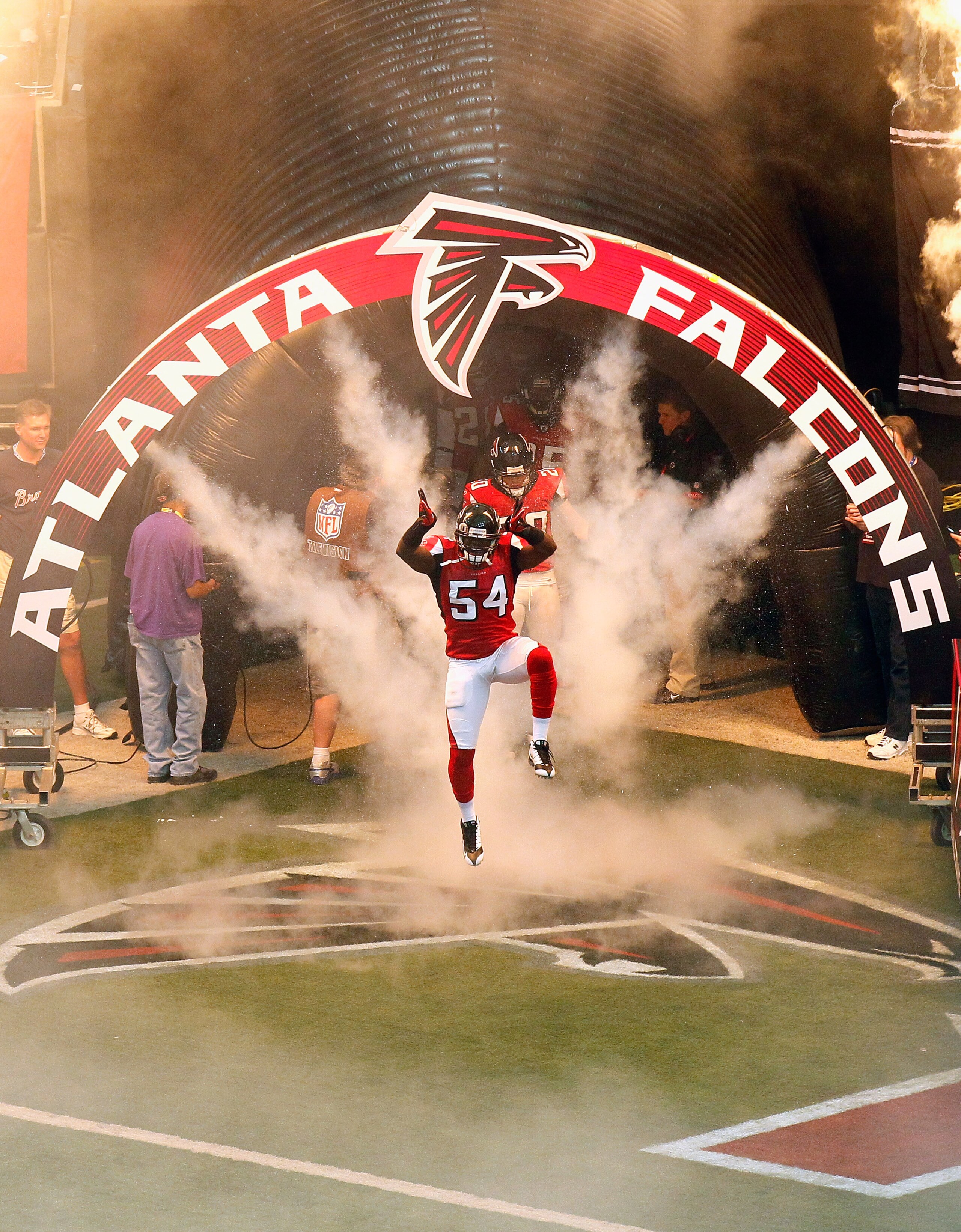 ATLANTA - NOVEMBER 07:  Stephen Nicholas #54 of the Atlanta Falcons enters the field during defensive player introductions before facing the Tampa Bay Buccaneers at Georgia Dome on November 7, 2010 in Atlanta, Georgia.  (Photo by Kevin C. Cox/Getty Images