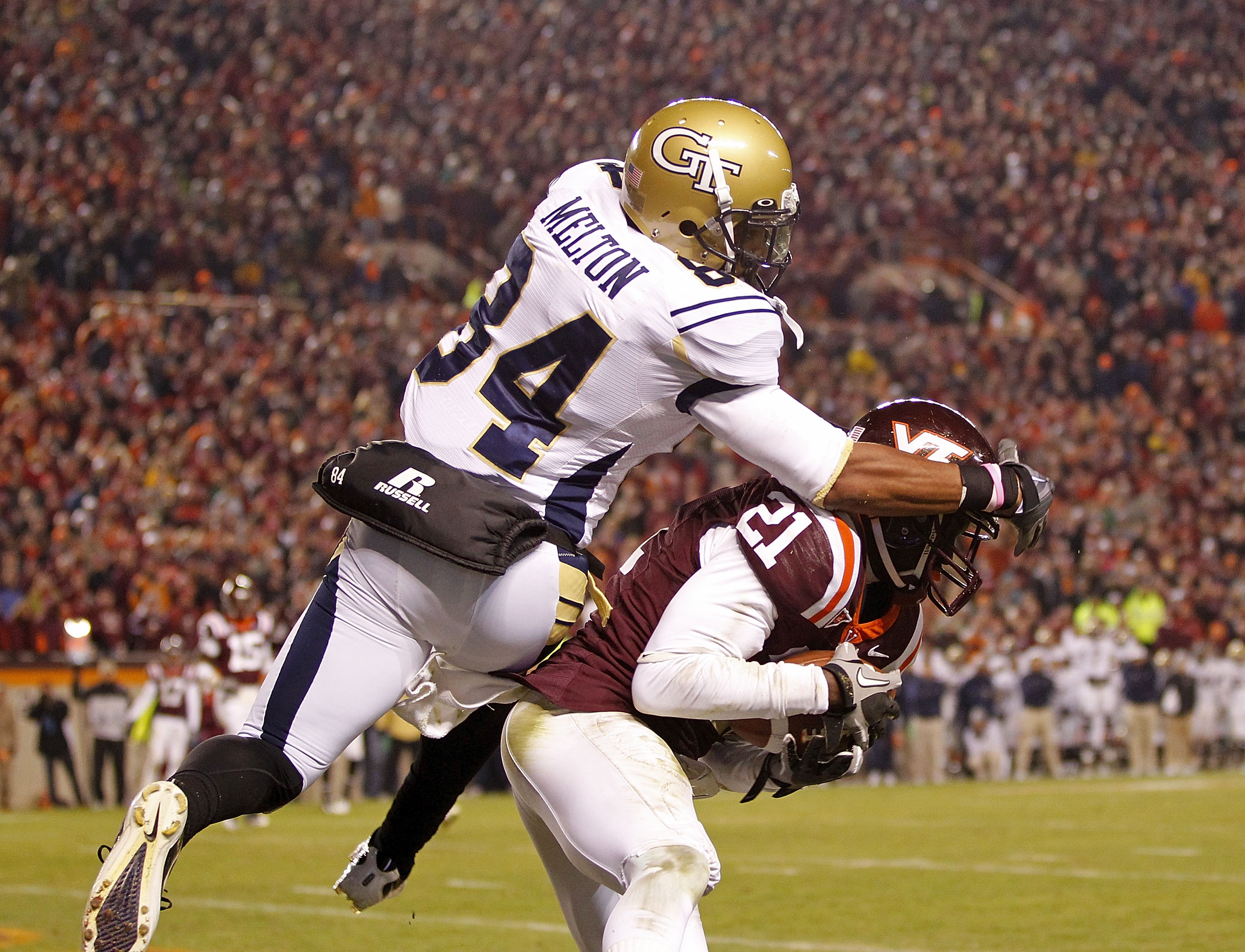 BLACKSBURG, VA - NOVEMBER 04:  Cornerback Rashad Carmichael #21 of the Virginia Tech Hokies intercepts a pass in the end zone in the final seconds intended for wide receiver Tyler Melton #84 of the Georgia Tech Yellow Jackets at Lane Stadium on November 4