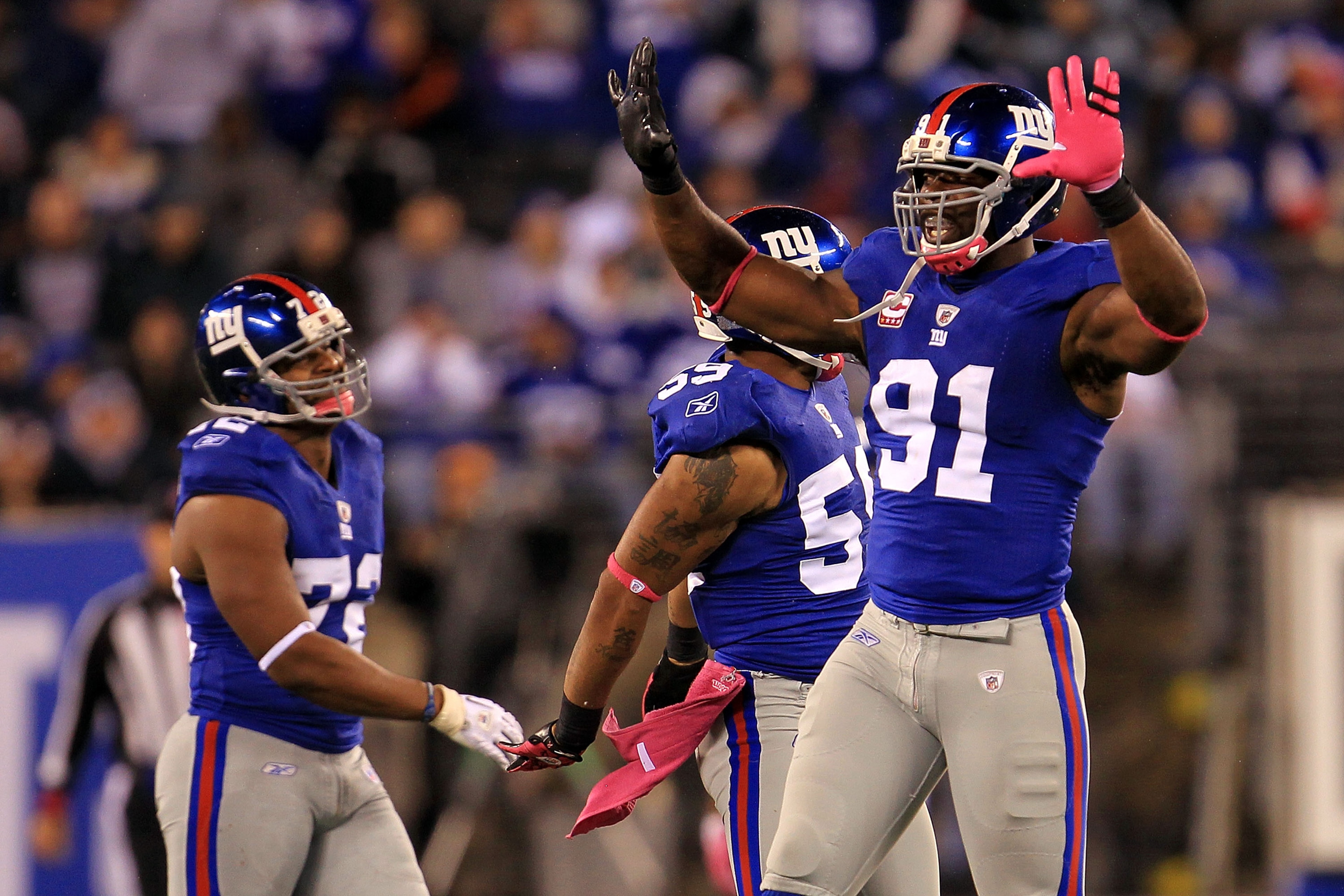 EAST RUTHERFORD, NJ - OCTOBER 03: Justin Tuck #91 of the New York Giants celebrates after the tenth sack of the game against the Chicago Bear at New Meadowlands Stadium on October 3, 2010 in East Rutherford, New Jersey. (Photo by Chris McGrath/Getty Ima EAST RUTHERFORD, NJ - OCTOBER 03: Justin Tuck #91 of the New York Giants celebrates after the tenth sack of the game against the Chicago Bear at New Meadowlands Stadium on October 3, 2010 in East Rutherford, New Jersey. (Photo by Chris McGrath/Getty Ima