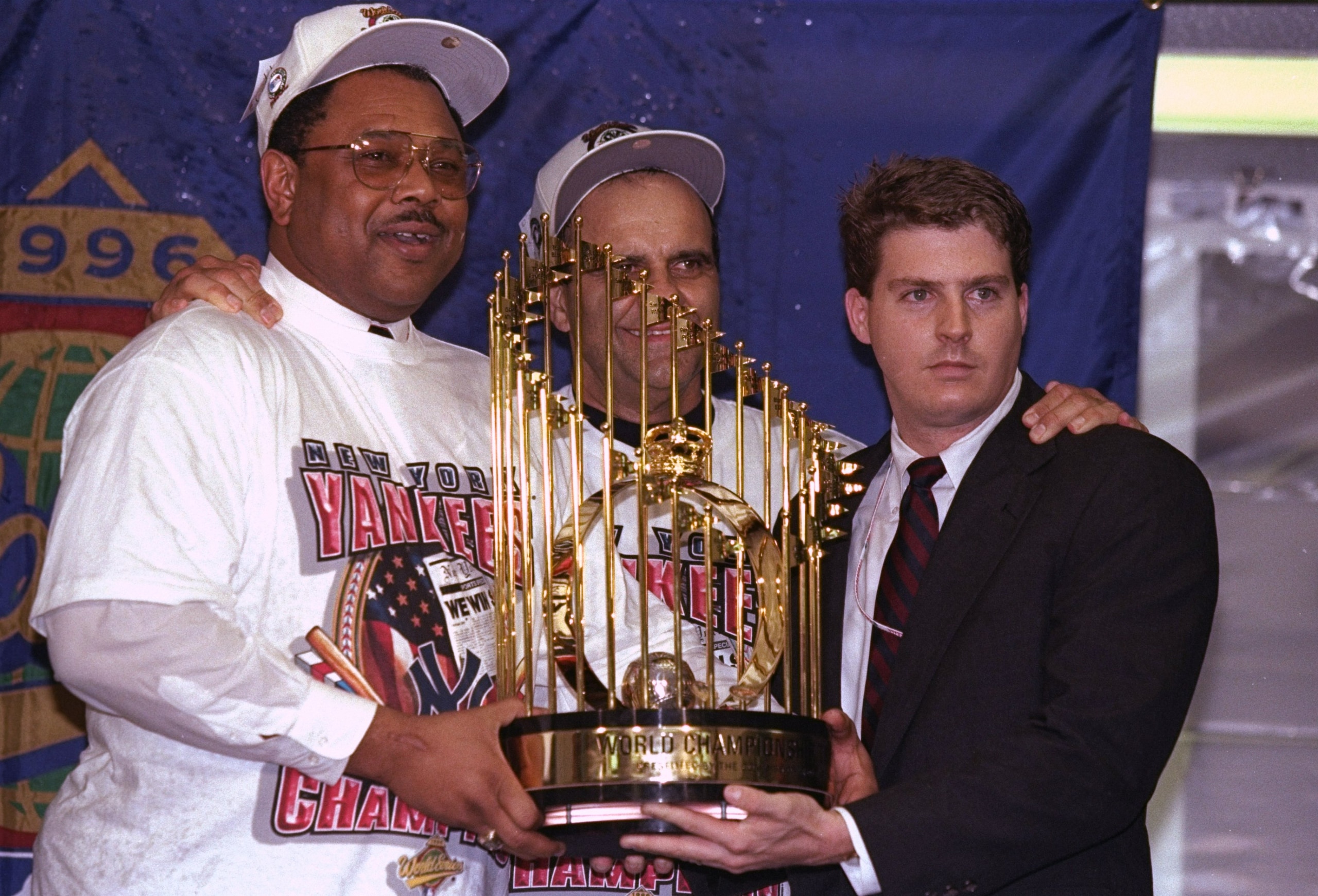 File Picture:  26 Oct 1996:  General manger Bob Watson and manager Joe Torre of the New York Yankees hold trophy after winning game six of the World Series against the Atlanta Braves at Yankee Stadium in Bronx, New York.  The Yankees won the game 3-2. Man