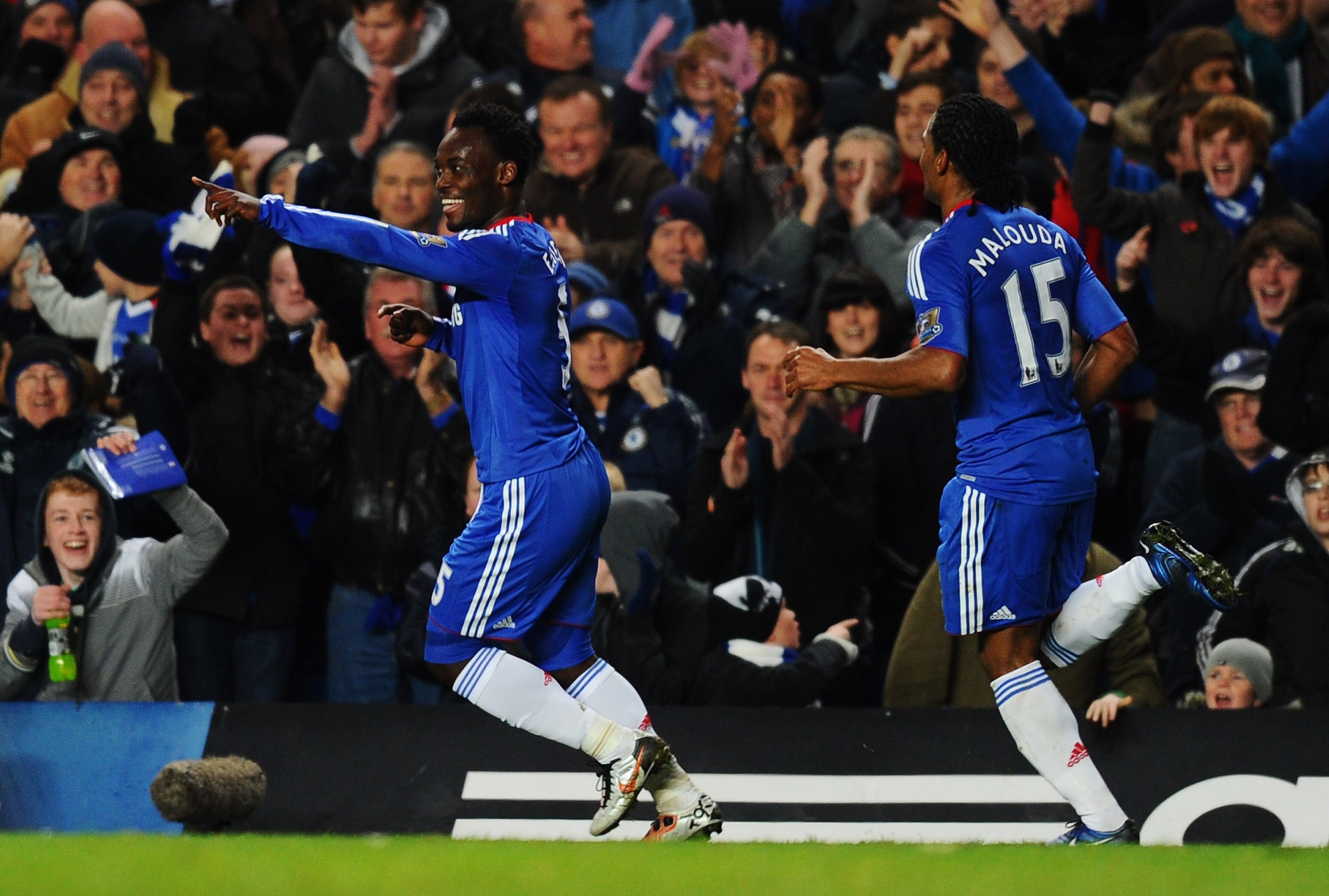 LONDON, ENGLAND - NOVEMBER 10:  Michael Essien of Chelsea celebrates with Florent Malouda (R) as he scores their first goal during the Barclays Premier League match between Chelsea and Fulham at Stamford Bridge on November 10, 2010 in London, England.  (P