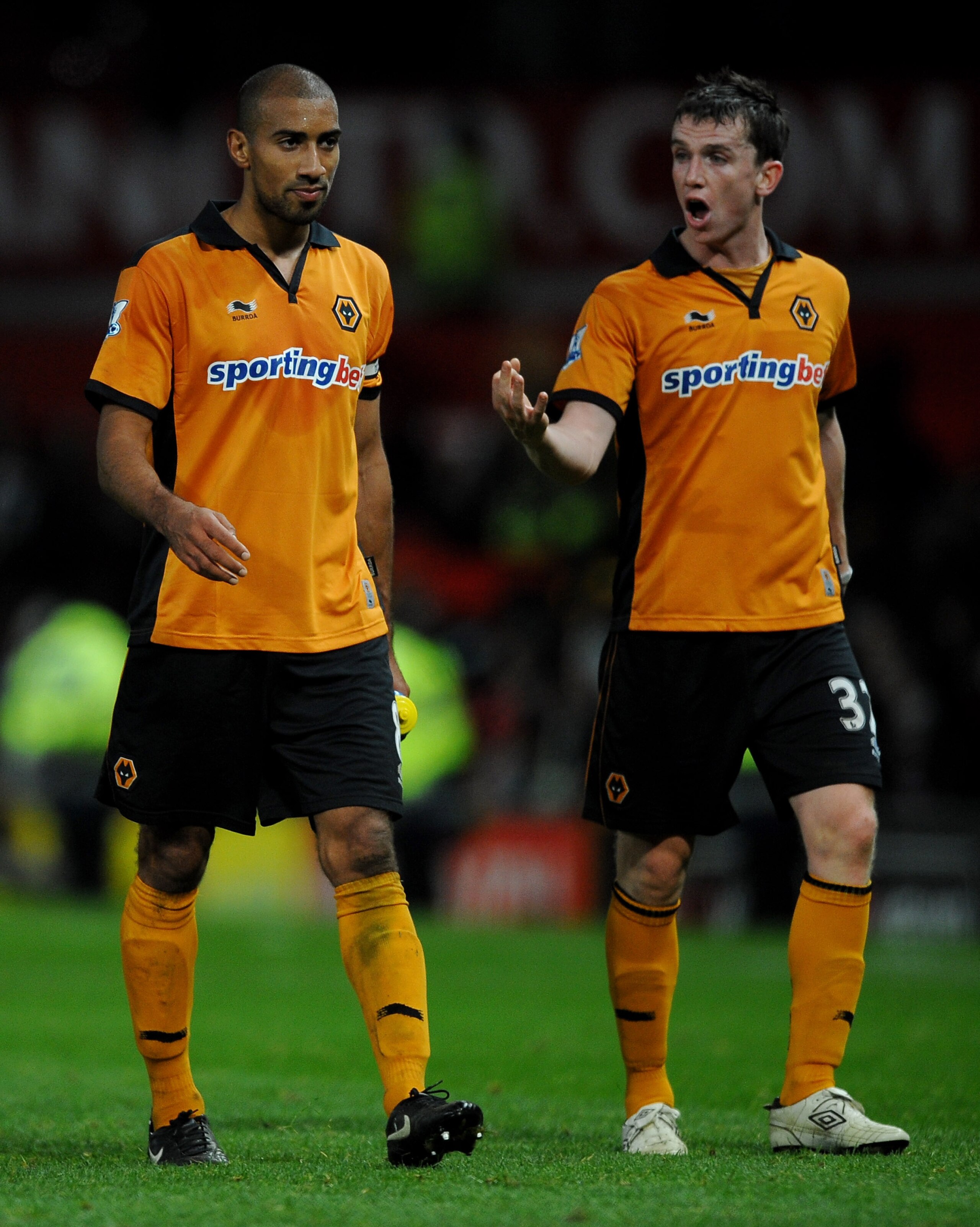 MANCHESTER, ENGLAND - NOVEMBER 06:  Karl Henry of Wolverhampton Wanderers and team mate Kevin Foley (R) leave the pitch at the end of the Barclays Premier League match between Manchester United and Wolverhampton Wanderers at Old Trafford on November 6, 20